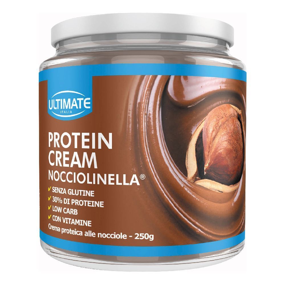 Vaso di crema proteica. Scritta: Protein Cream Nocciolinella, 30% proteine, senza glutine, low carb, con vitamine. Nocciola.
