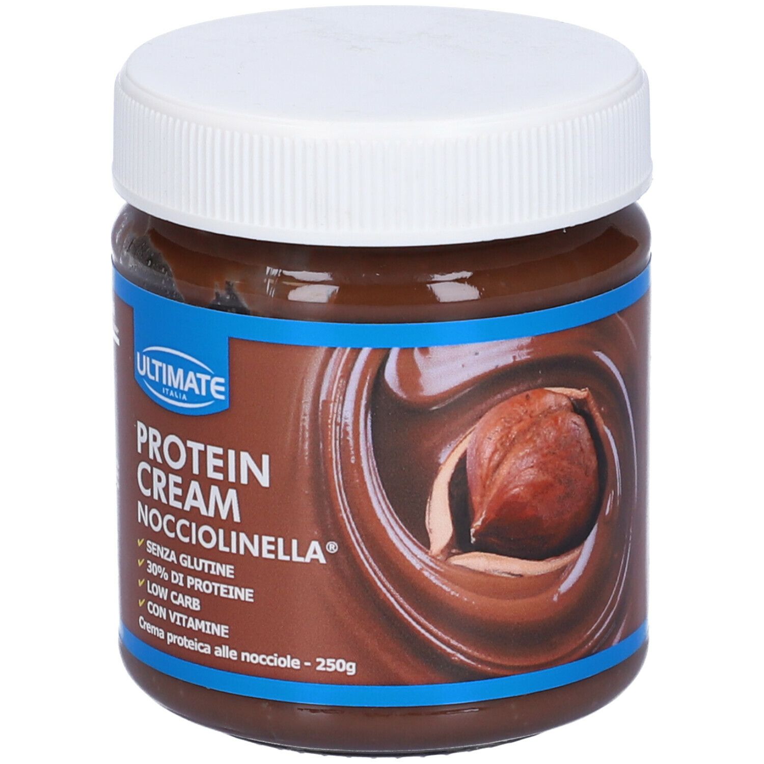 Vaso di crema proteica. Scritta: Protein Cream Nocciolinella, 30% proteine, senza glutine, low carb, con vitamine. Nocciola.