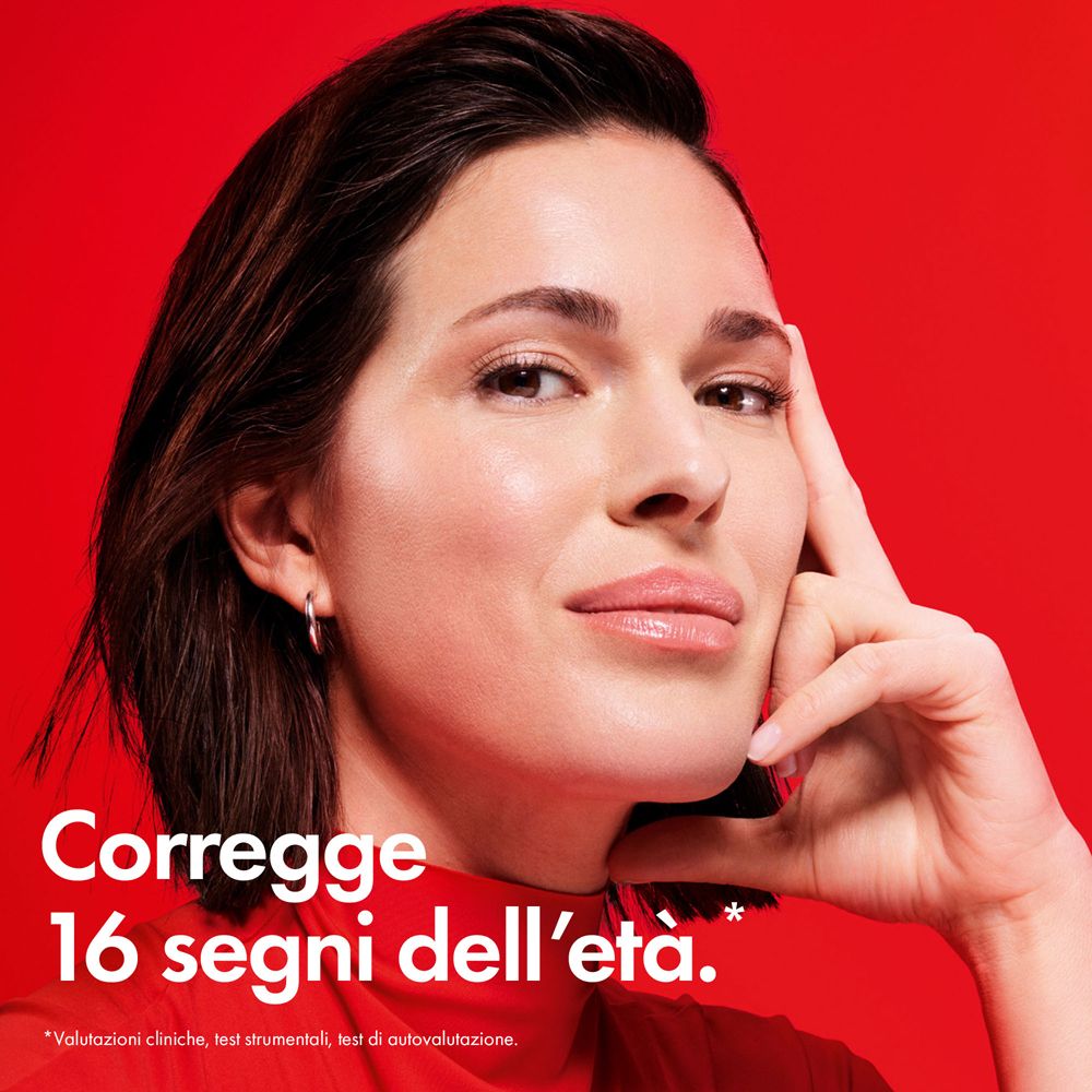 Donna, mano sul mento. Testo: Corregge 16 segni dell'età. Sfondo rosso.