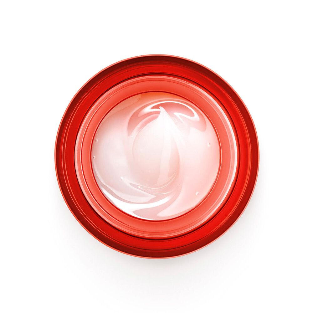 Vista dall'alto di un vaso rotondo trasparente con bordo rosso e crema bianca.