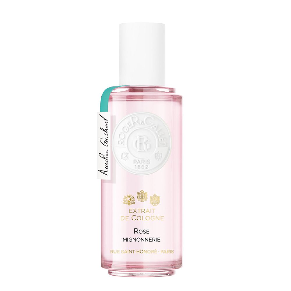 Extrait de Cologne Rose Mignonnerie, flacon en verre blanc. Étiquette avec logo et texte.