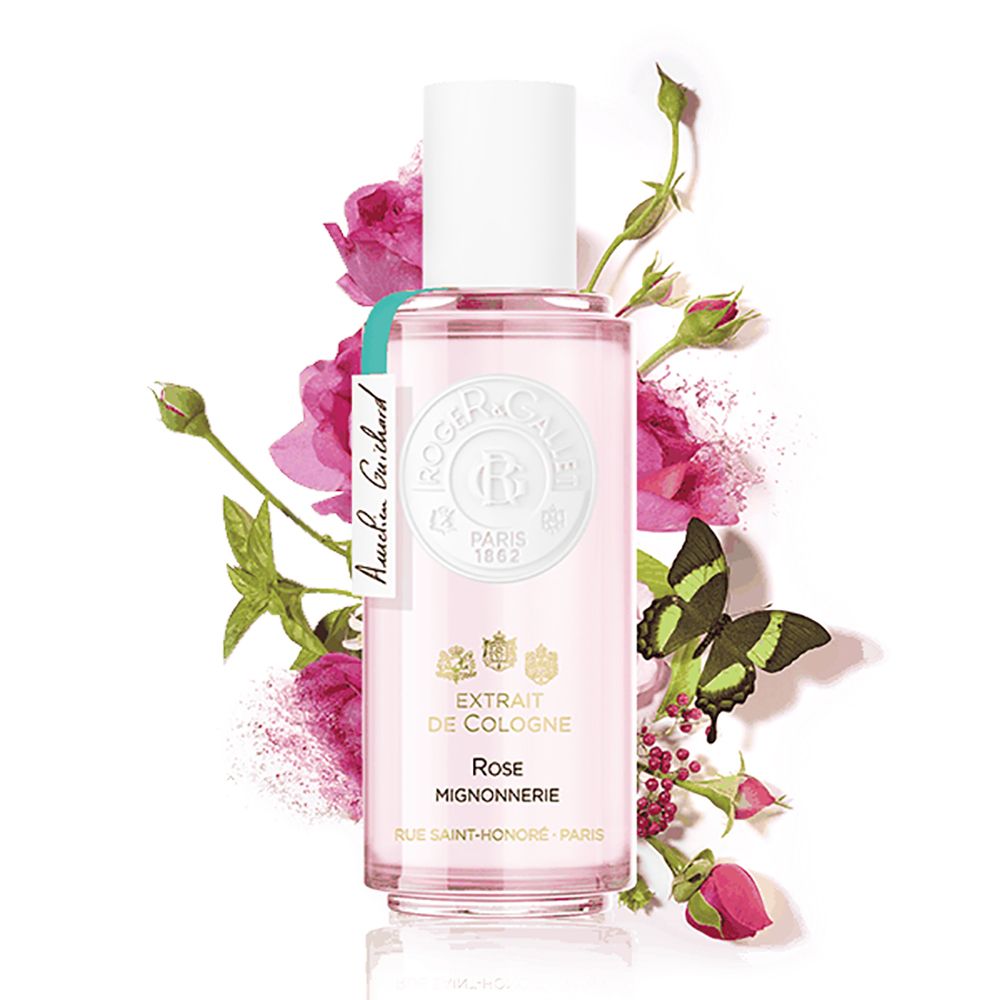 Extrait de Cologne Rose Mignonnerie, flacon avec fleurs et papillon en arrière-plan.