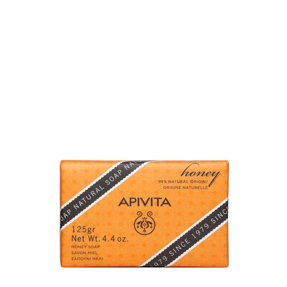 Sapone arancione con 'Apivita'. Confezione con strisce diagonali e testo. 125g, sapone al miele.