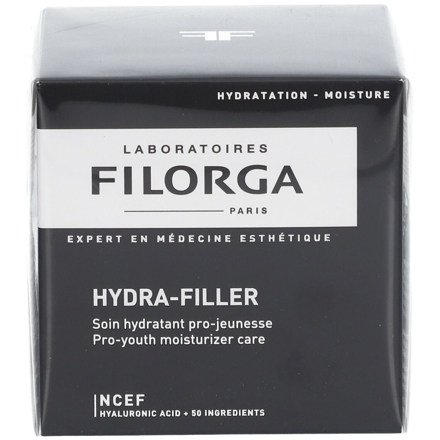 Schwarzer Karton mit weißem Etikett. Aufschrift FILORGA HYDRA-FILLER. Französische Produktbezeichnung und englische Übersetzung.