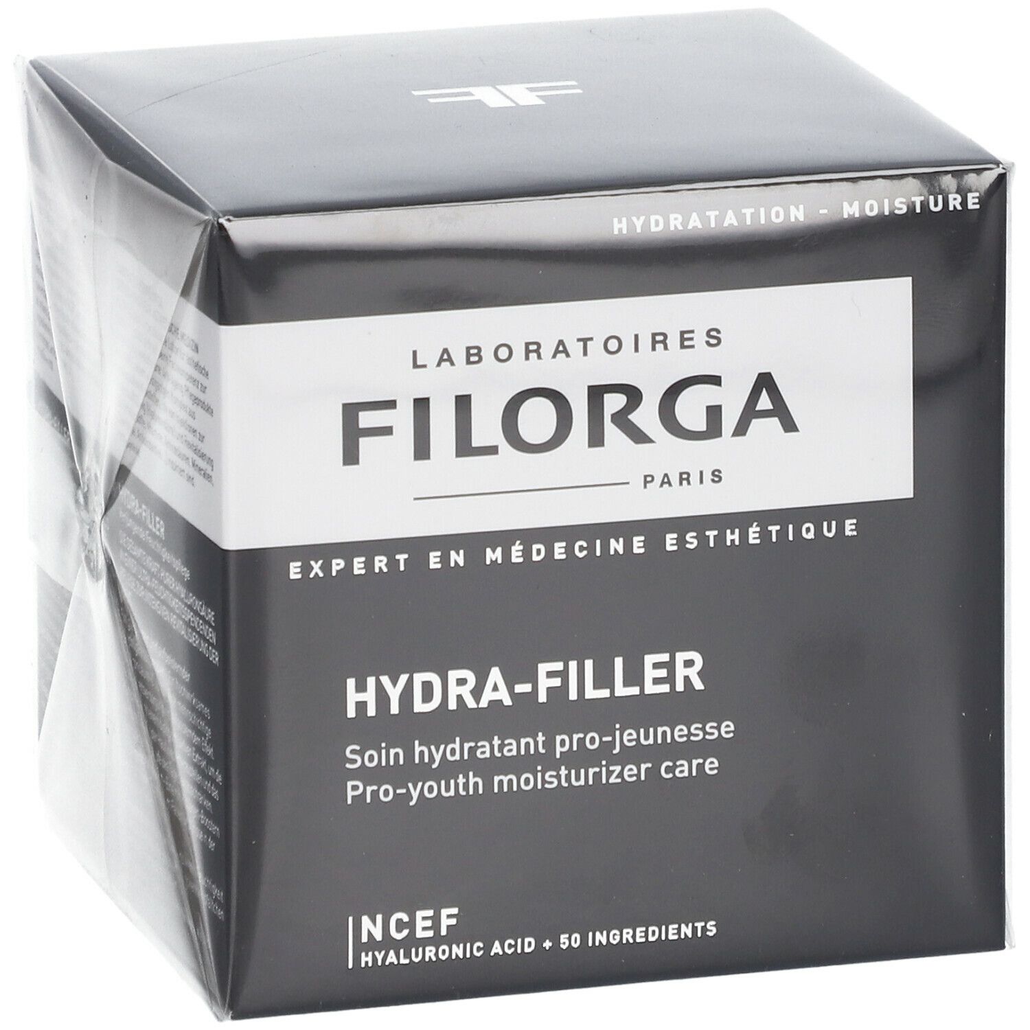 Schwarzer Karton mit weißem Etikett. Aufschrift FILORGA HYDRA-FILLER. Französische Produktbezeichnung und englische Übersetzung.