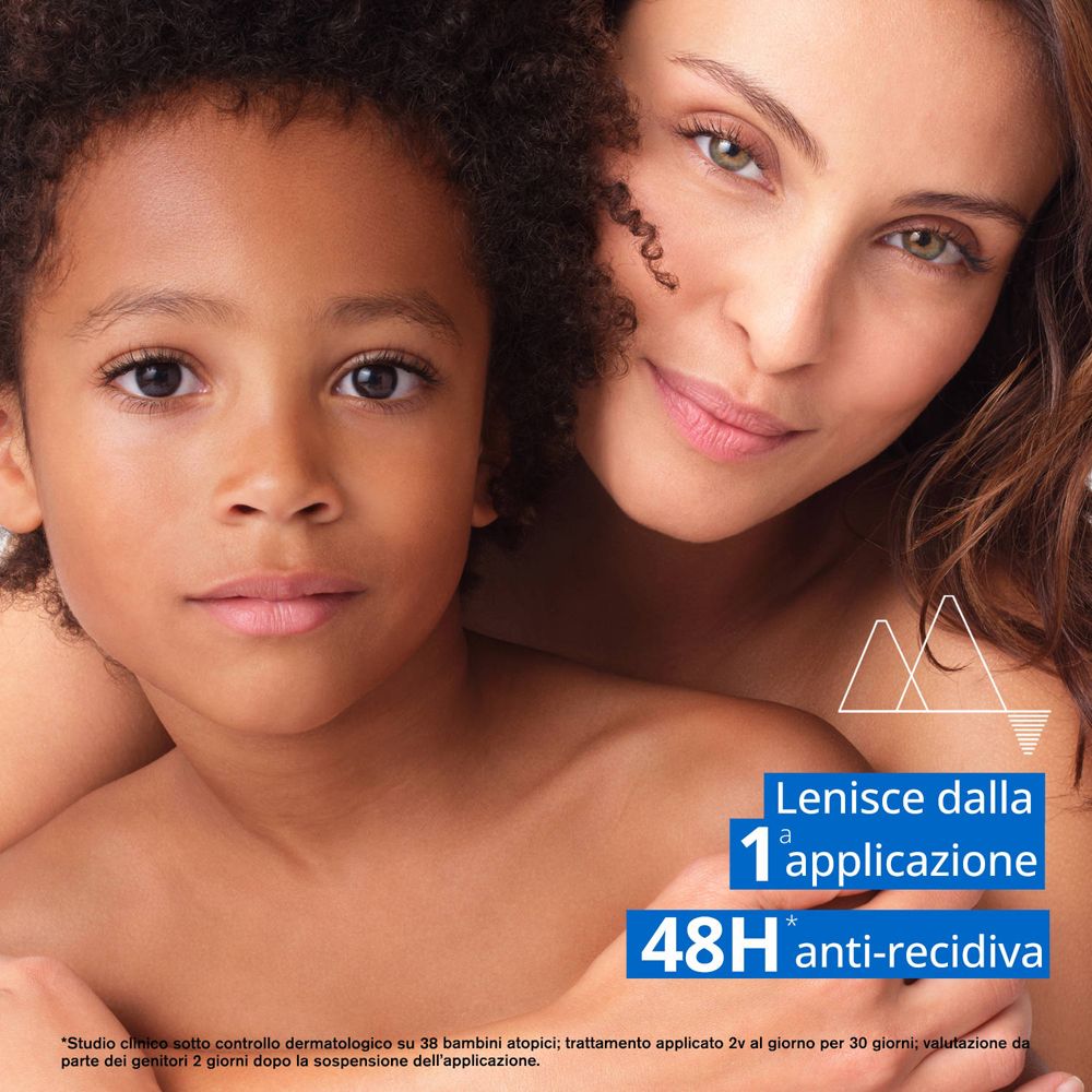 Donna e bambino. Testo: «Lenisce dalla 1a applicazione». Testo: «48H anti-recidiva». Grafica con montagne.