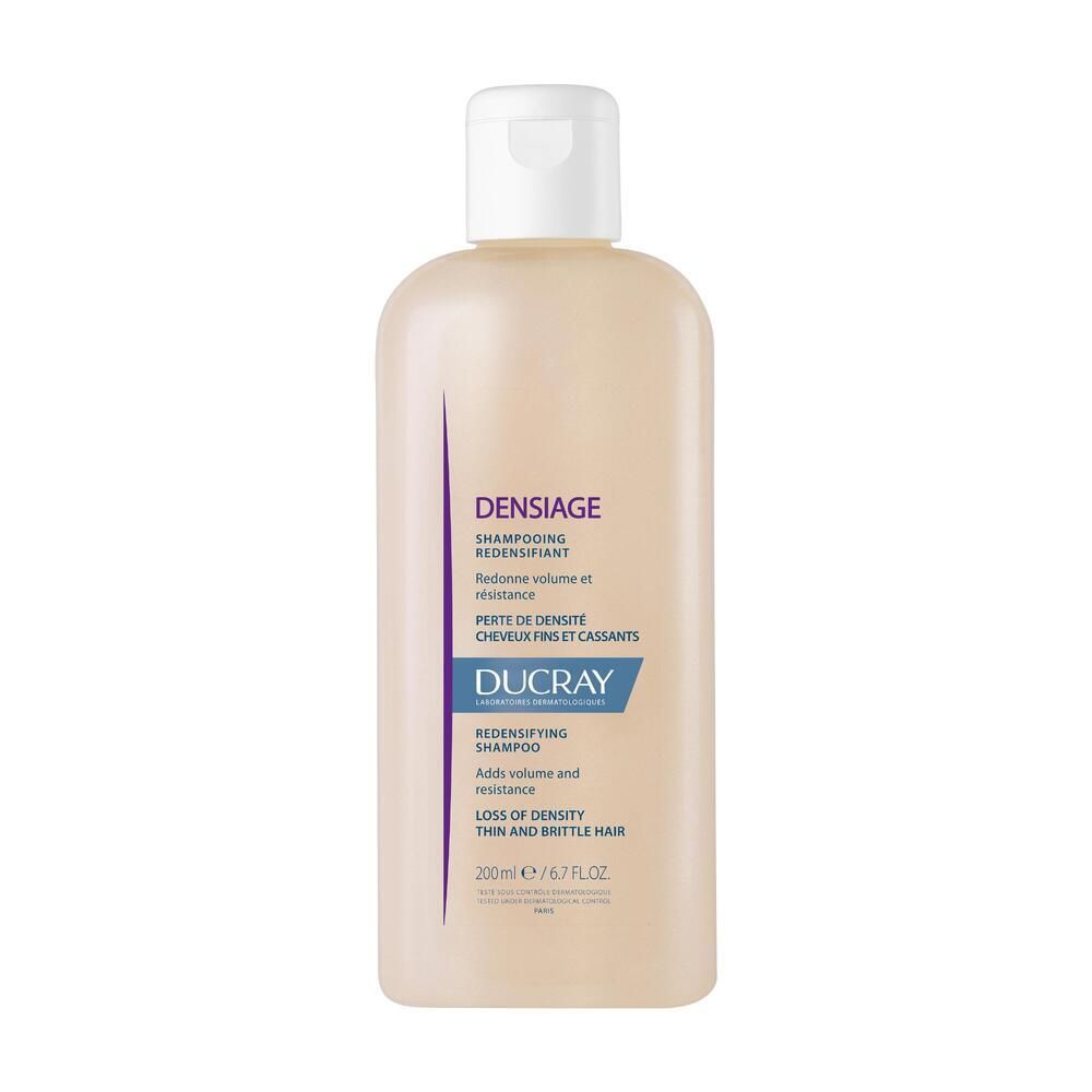 Flacone di shampoo beige con tappo bianco. Scritte: Densiage, Shampooing Redensifiant, Ducray. 200ml.