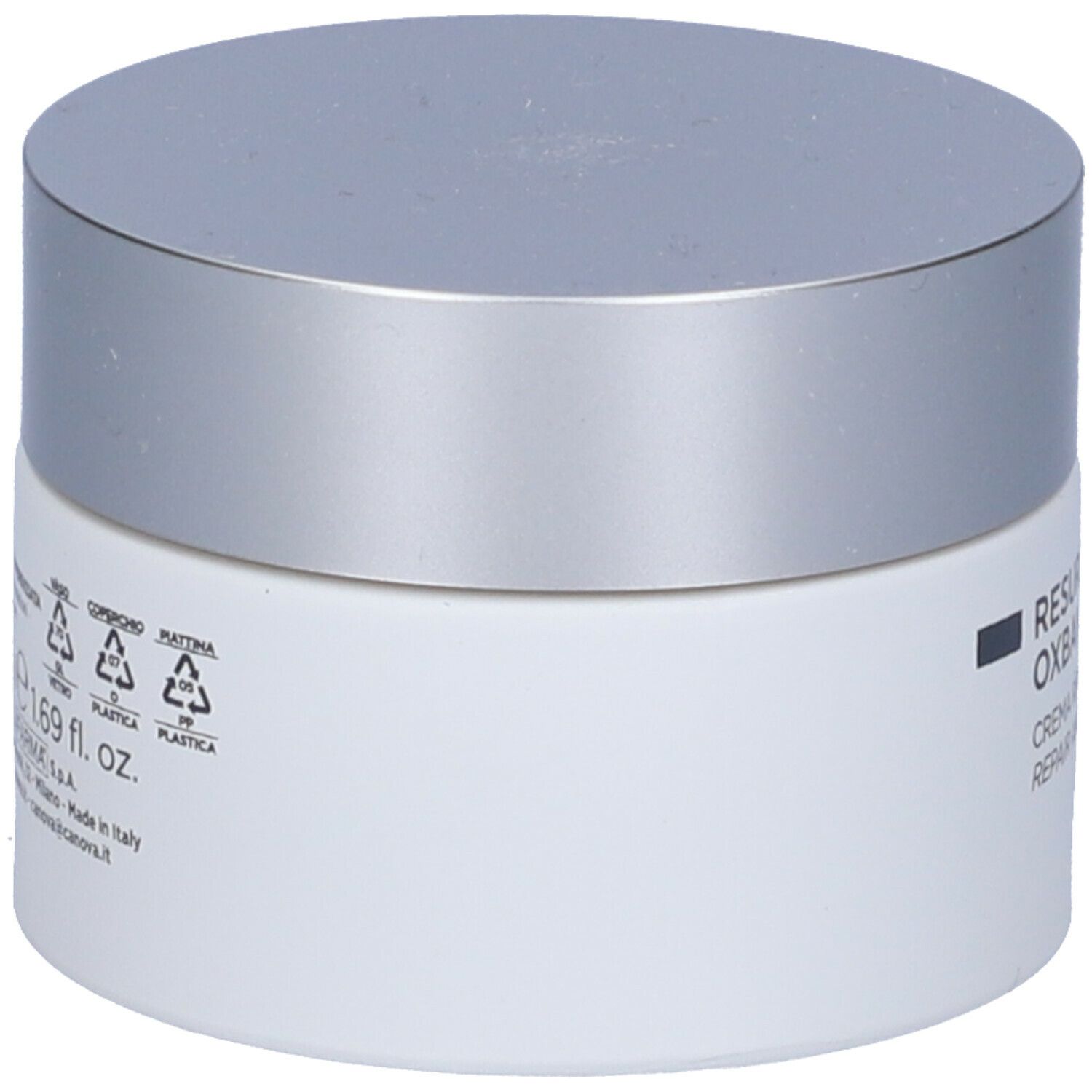Vasetto di crema bianco con coperchio argentato. Testo e simboli sul lato. Prodotto in Italia. 1,69 fl. oz.
