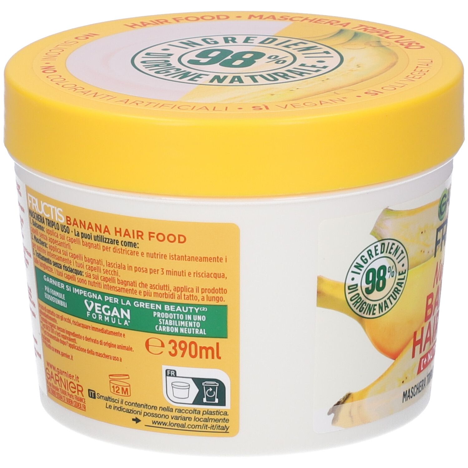 Barattolo con coperchio giallo. Scritta: Garnier Fructis Banana Hair Food. Formula vegana. 390ml.