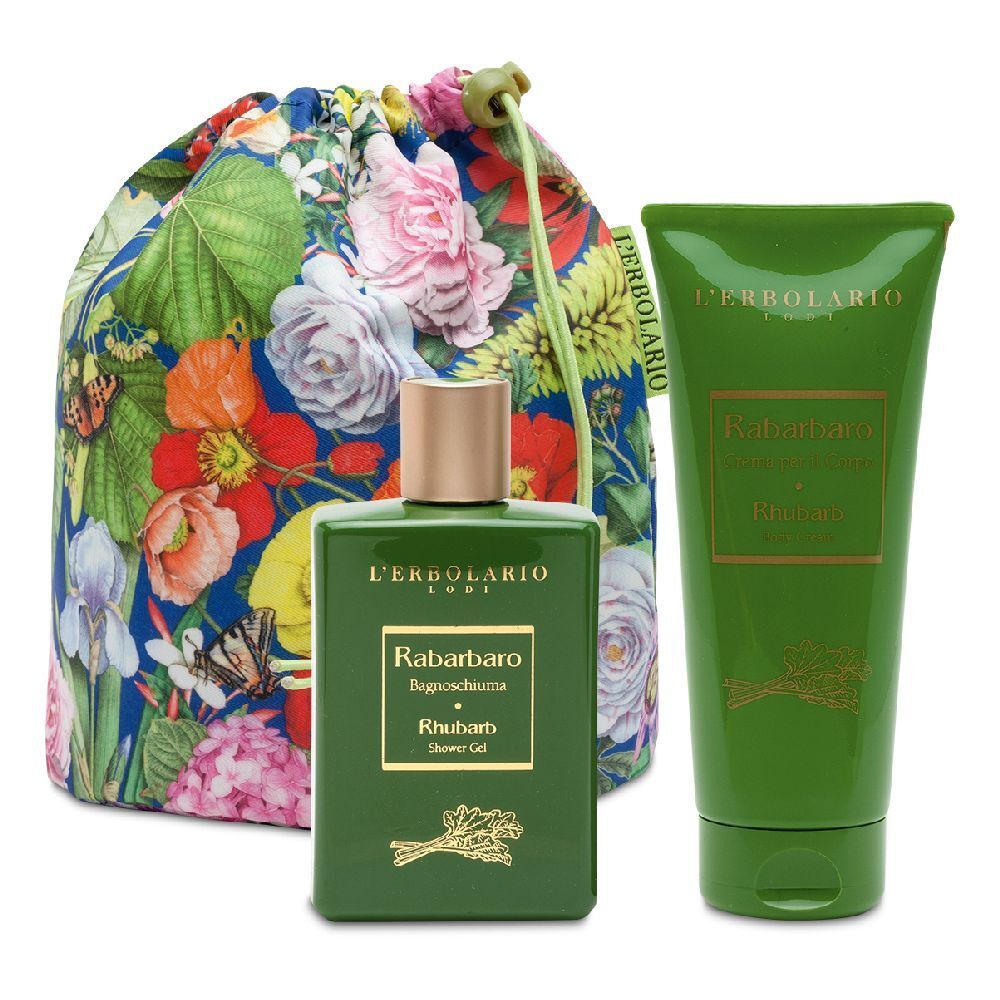 Set regalo di prodotti cosmetici. Include una bottiglia verde, un tubetto e un sacchetto a fantasia floreale. Scritta: L'Erbolario.