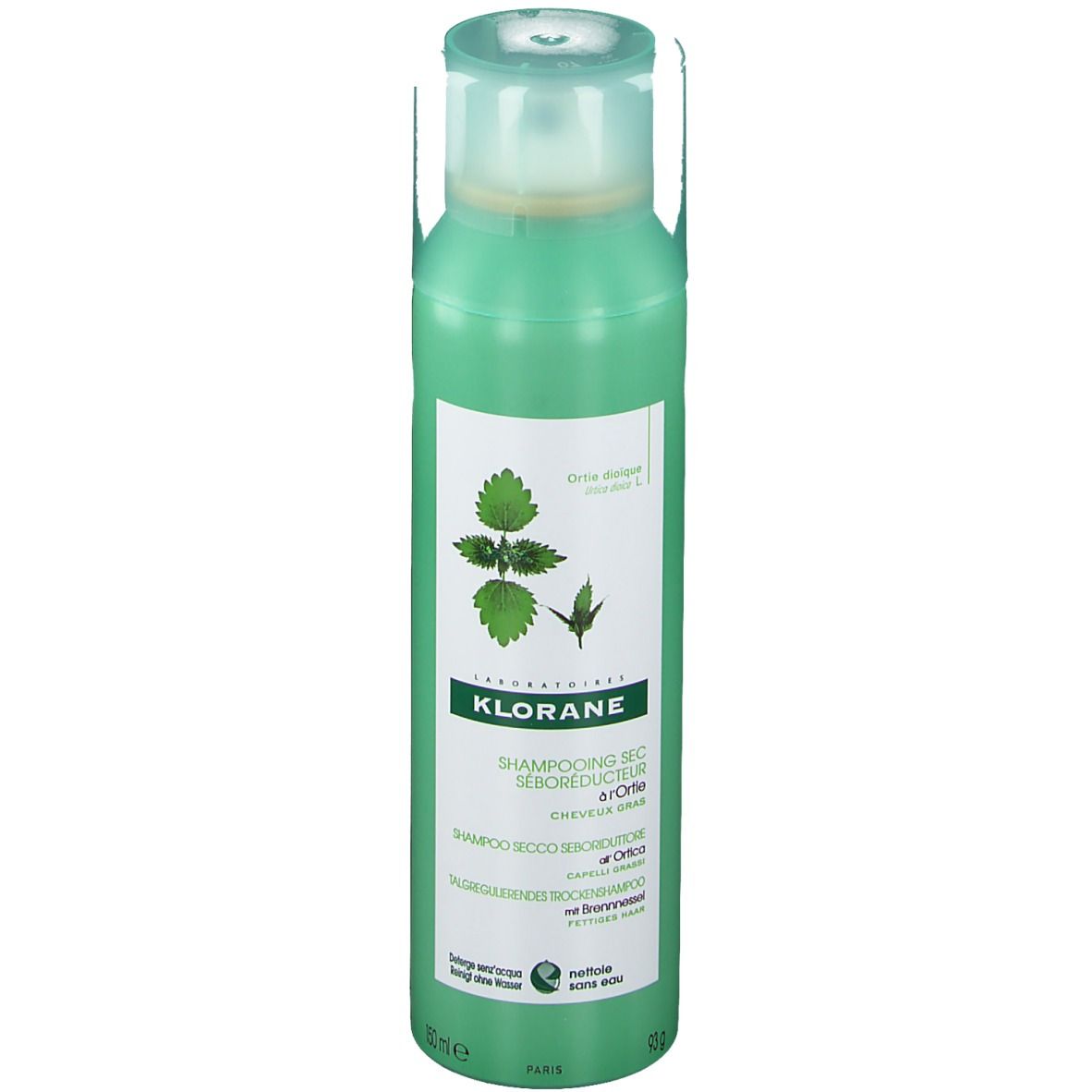 Flacon spray vert avec étiquette blanche. Shampooing sec KLORANE à l'ortie. Bouchon verdâtre.