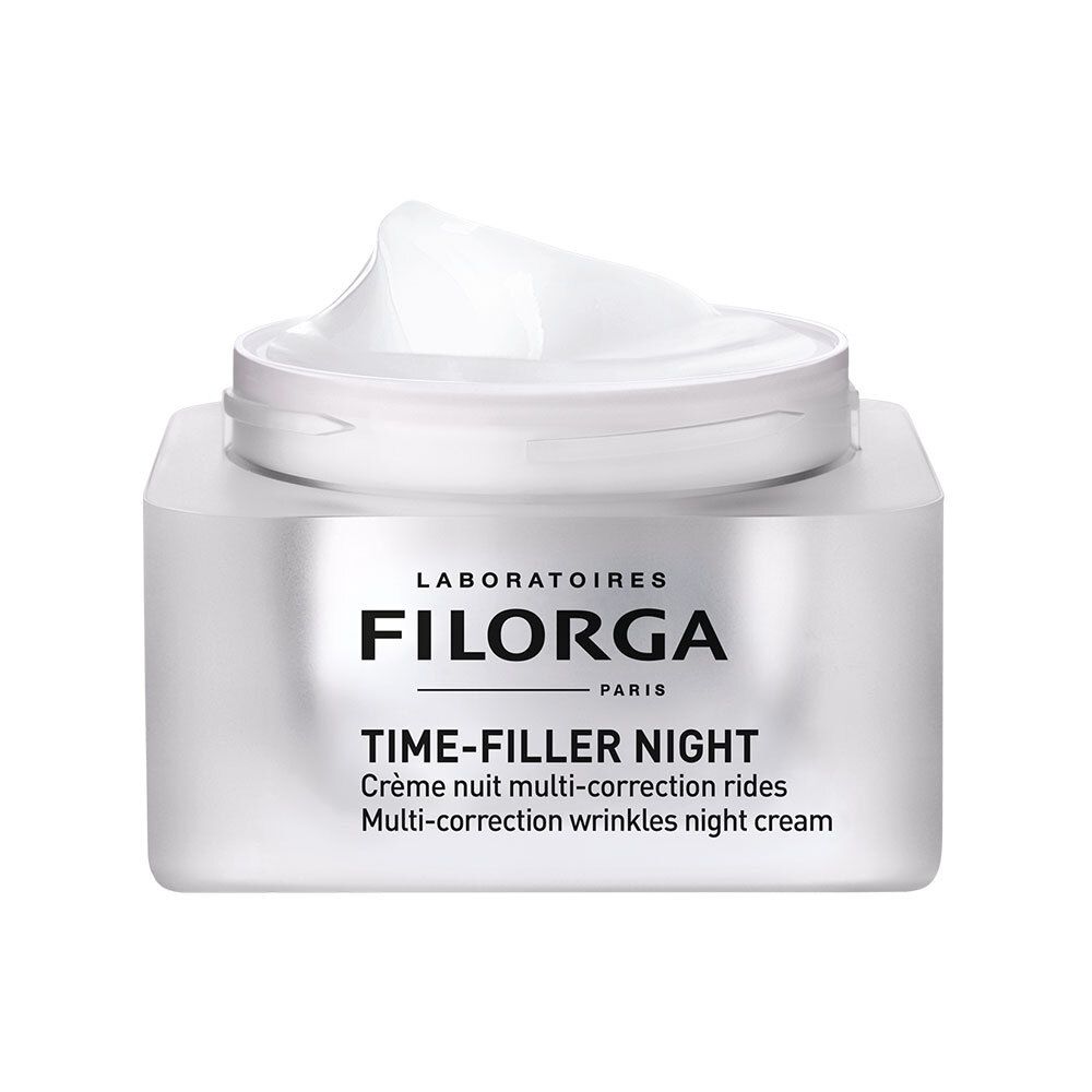 Weißer Tiegel mit silberfarbenem Deckel, geöffnet. Creme sichtbar. Aufschrift: FILORGA, TIME-FILLER NIGHT. Nachtcreme.