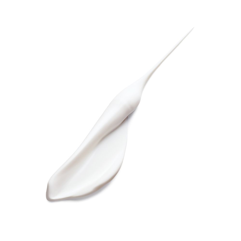 Éclaboussure de crème blanche sur fond blanc. Forme allongée, extrémité pointue.