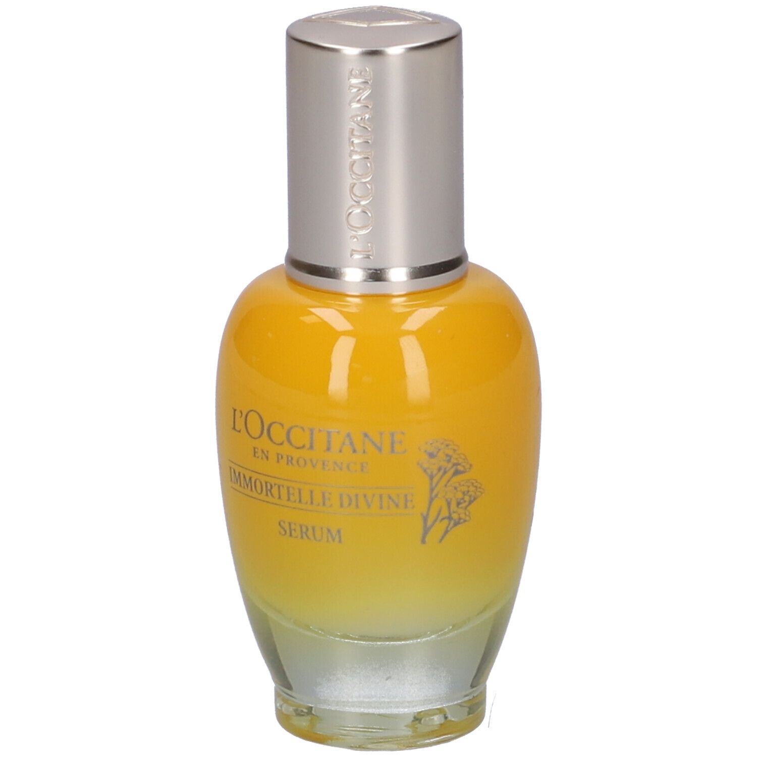 Flacone di siero giallo trasparente con tappo argentato. Scritta: L'Occitane, Immortelle Divine Serum.