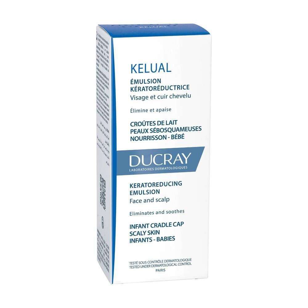 Scatola bianca con testo blu. Contiene Kelual Emulsion. Per viso e cuoio capelluto. Per neonati.