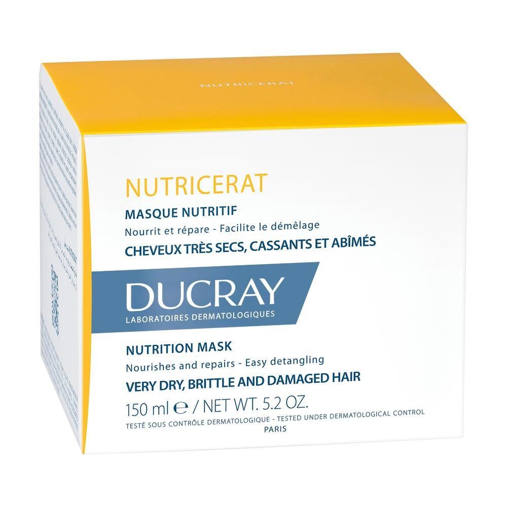 Boîte jaune et blanche avec informations produit. Masque pour cheveux secs et cassants. Marque Ducray.