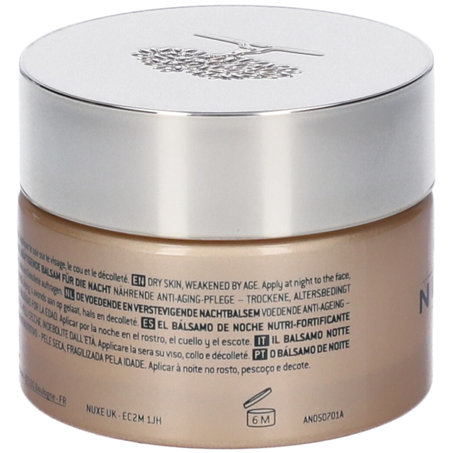 Vaso di crema con coperchio argentato. Scritta Nuxe Paris e Nuxuriance. Testo: Le Baume Nuit Nutri-Fortifiant, Anti-Age Nutrition. Testo sul retro.