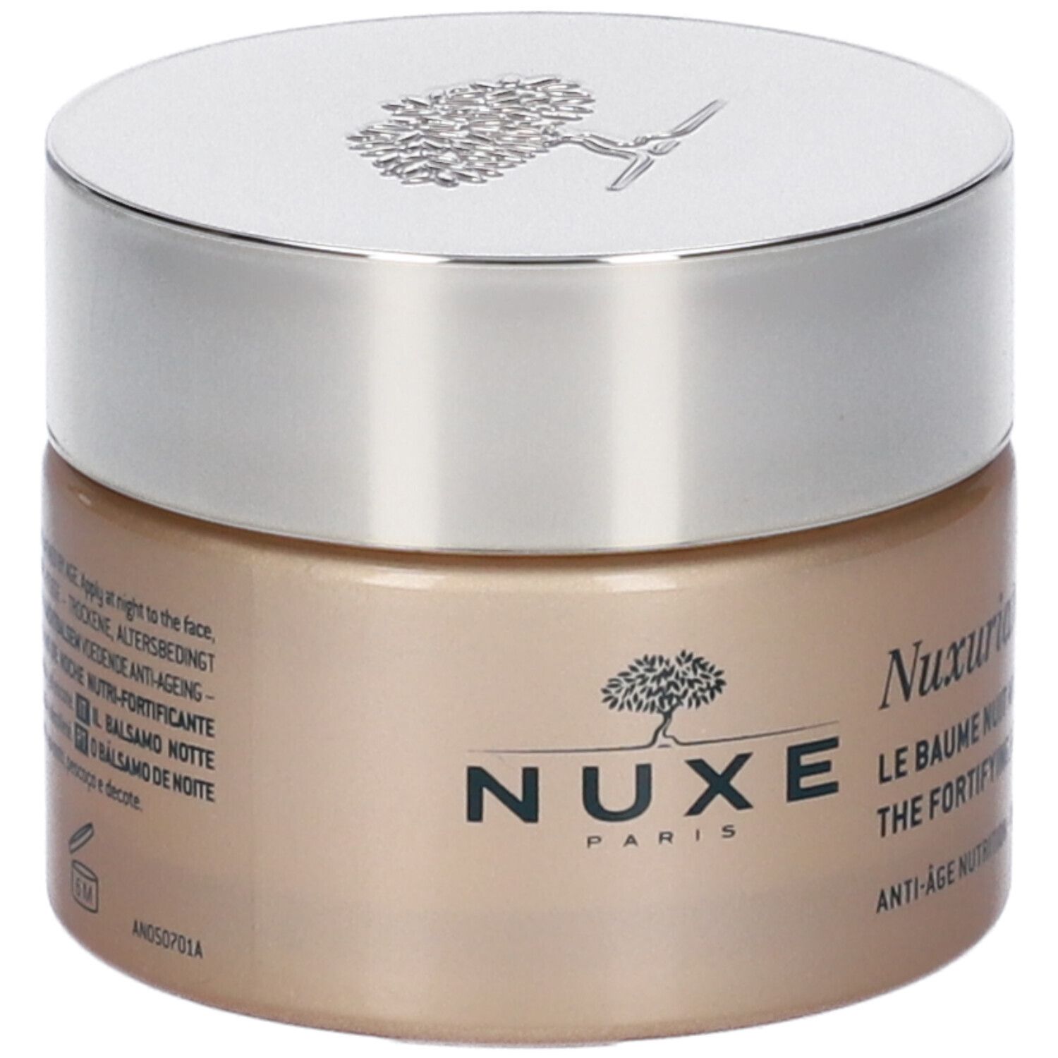 Vaso di crema con coperchio argentato. Scritta Nuxe Paris e Nuxuriance. Testo: Le Baume Nuit Nutri-Fortifiant, Anti-Age Nutrition. Testo sul retro.