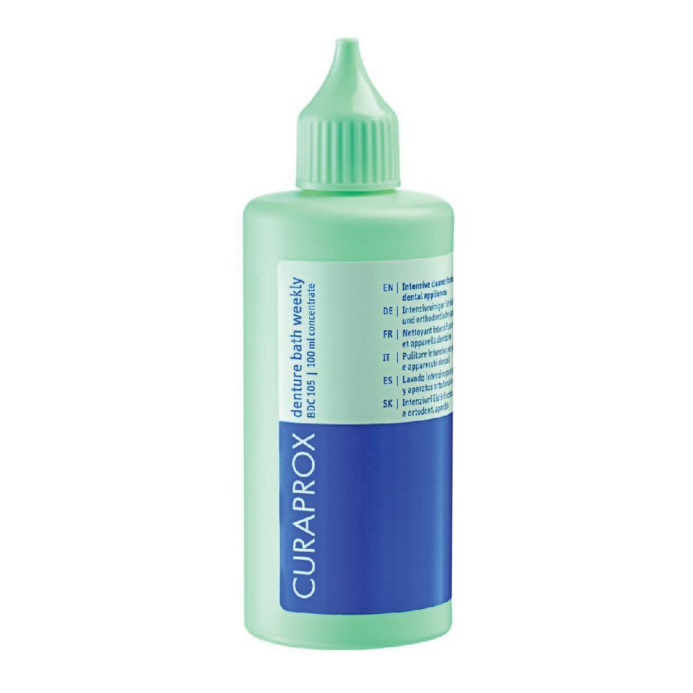 Flacone verde con beccuccio dosatore. Etichetta blu con logo CURAPROX. Testo: denture bath weekly BDC 105.