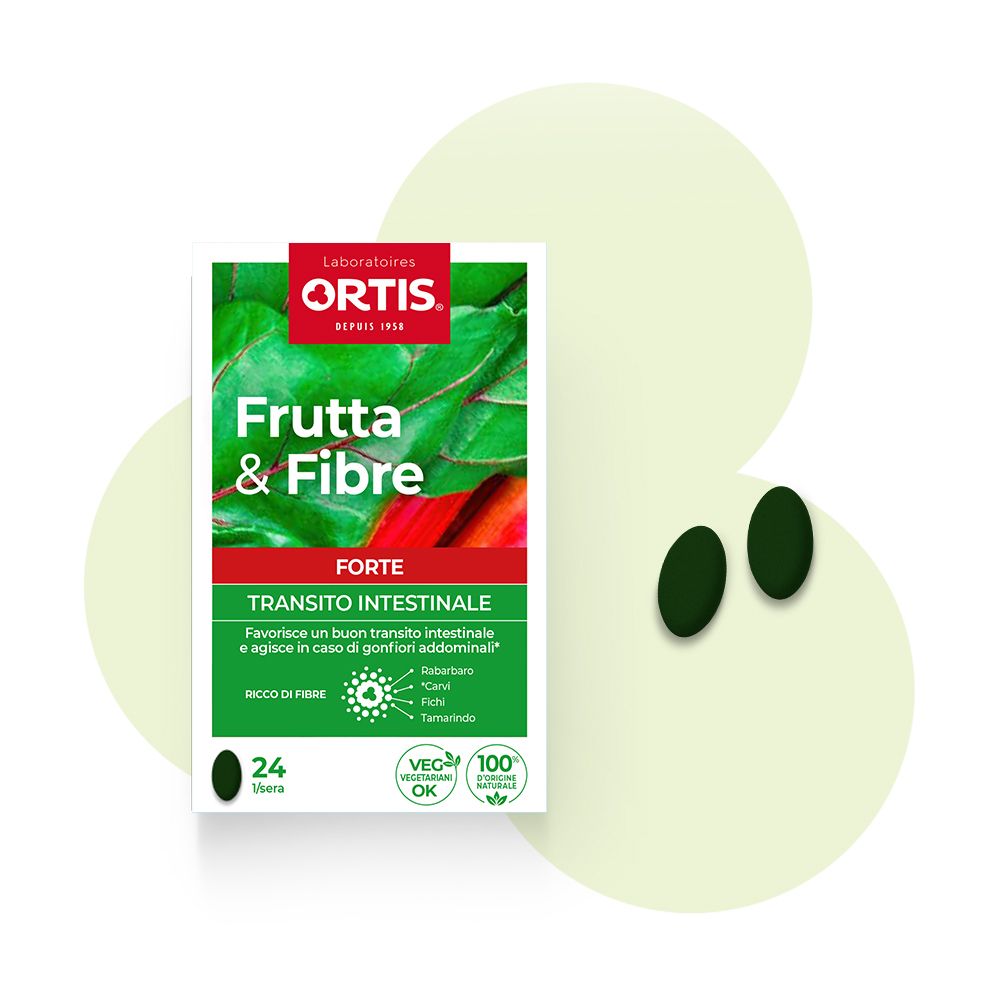 Due compresse verdi accanto a una scatola "Ortis Frutta & Fibre Forte Compresse". Design verde e bianco con nome del prodotto.