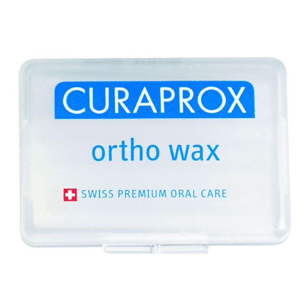 Scatola di plastica trasparente con coperchio blu. Scritta CURAPROX, ortho wax e Swiss Premium Oral Care.