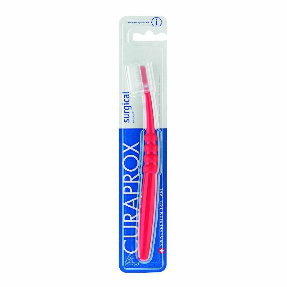 Spazzolino rosso in confezione blister. Testina bianca, manico ergonomico. Marchio Curaprox, scritta 'surgical mega soft'.