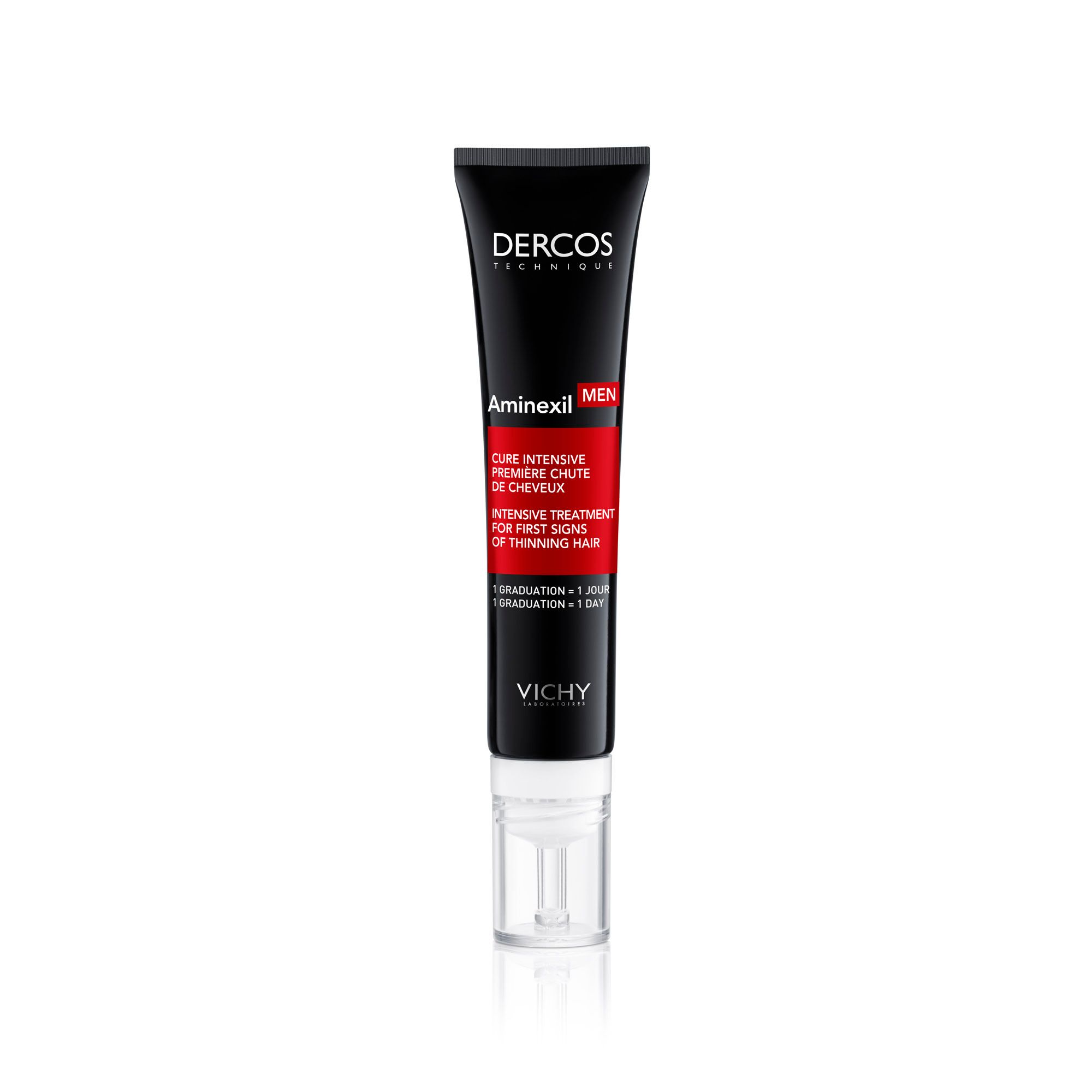 Tube noir avec applicateur blanc. Inscription: Dercos, Aminexil Men. Texte rouge: Cure Intensive Première Chute de Cheveux.