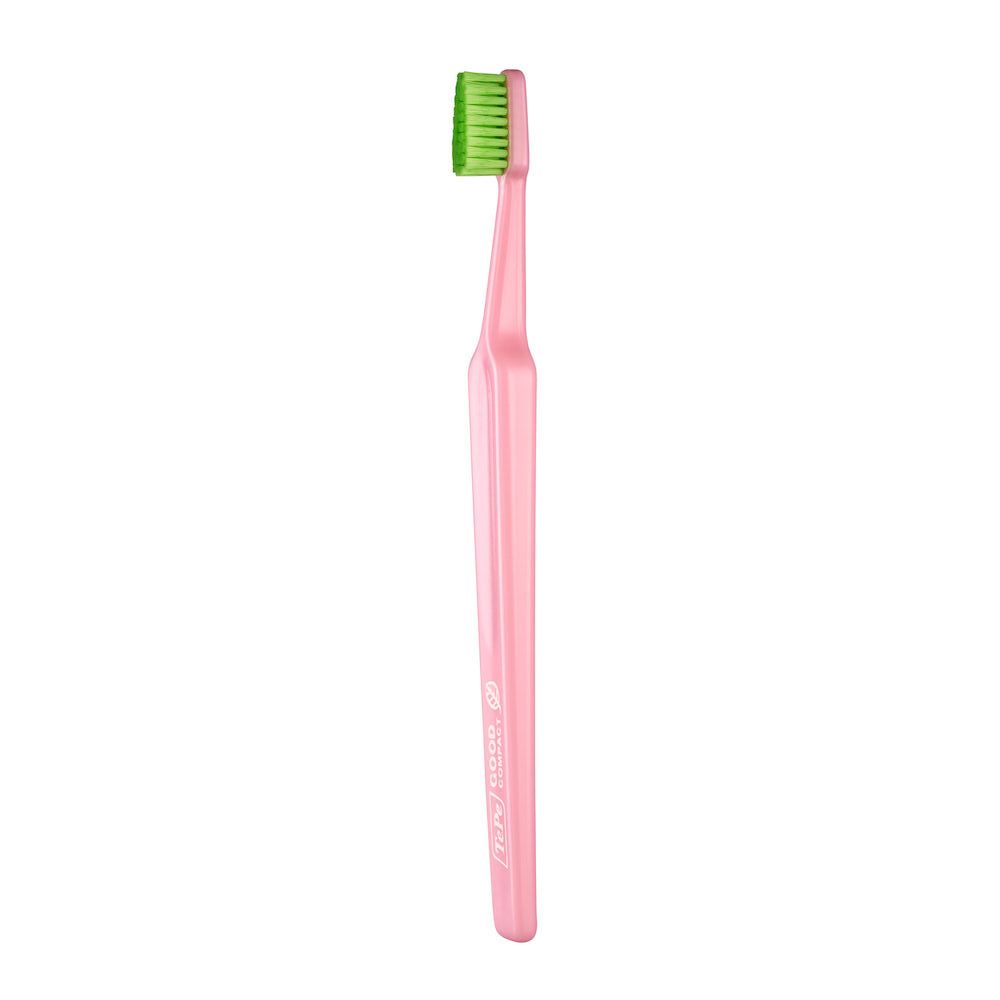 Spazzolino rosa GOOD Compact Soft con testina verde. Vista prospettica.