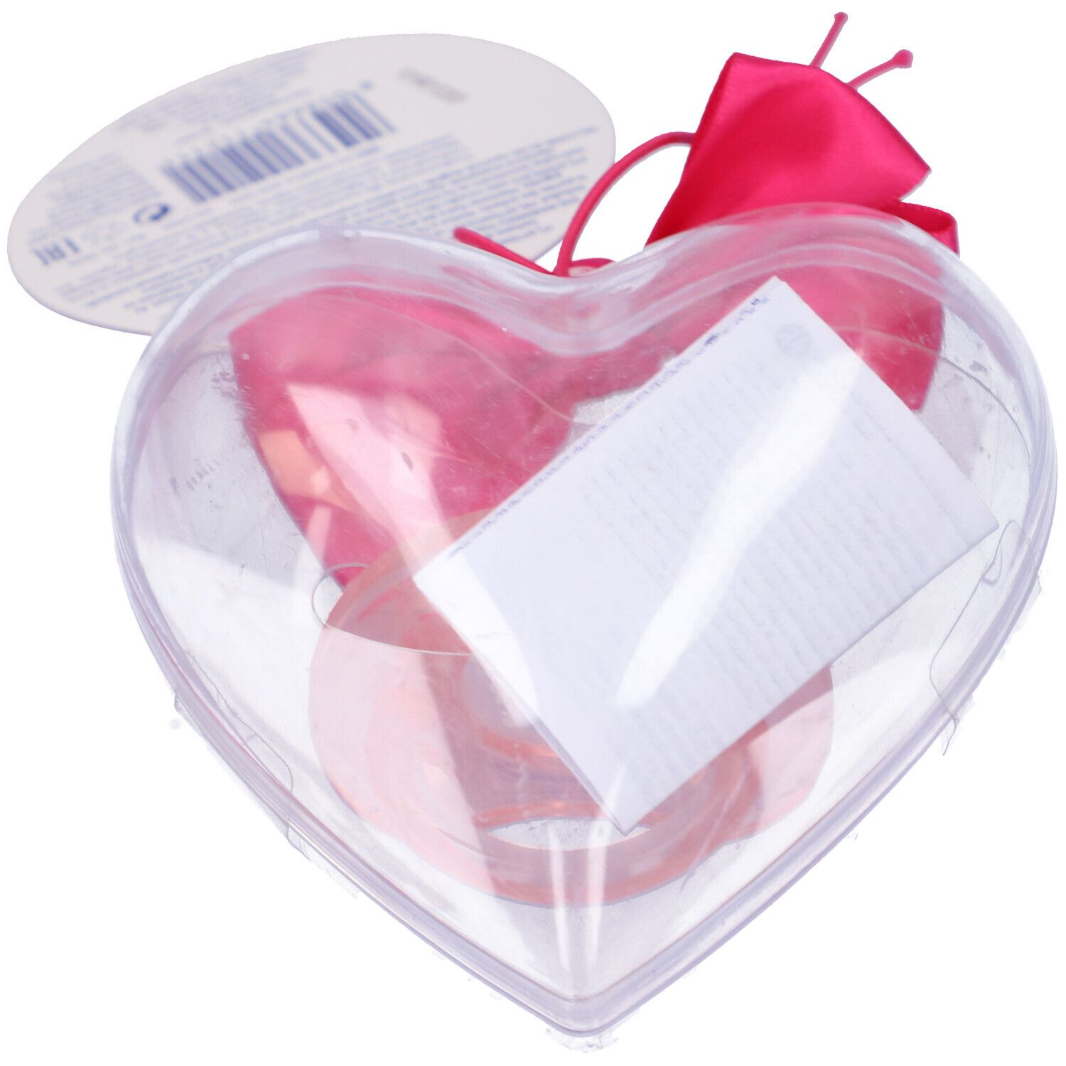 Confezione trasparente a forma di cuore con succhietto rosa. Include etichetta e fiocco. Retro con codice a barre e testo.