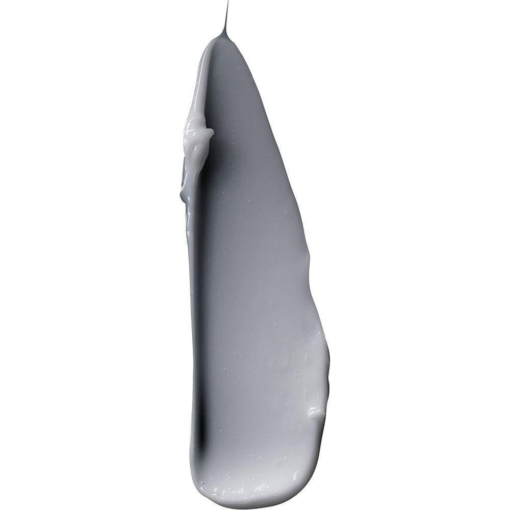 Échantillon de crème grise sur fond blanc. Texture de la crème VICHY Homme.