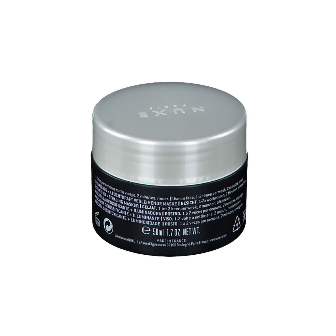 Vasetto nero con coperchio argentato. Scritta: NUXE PARIS. Testo sul retro. E50ml 1.7 OZ. NET WT. Made in France.