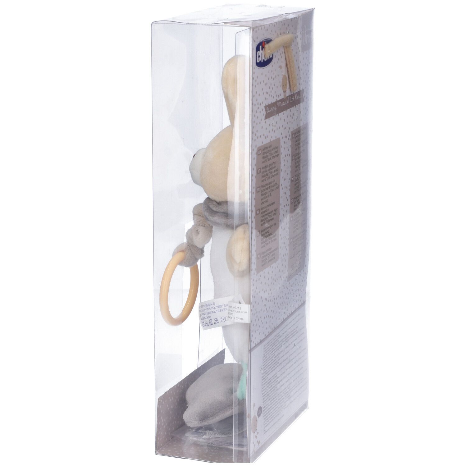 Giocattolo Chicco, coniglio con orecchie. Beige, bianco e grigio. Anello giallo. In confezione trasparente.
