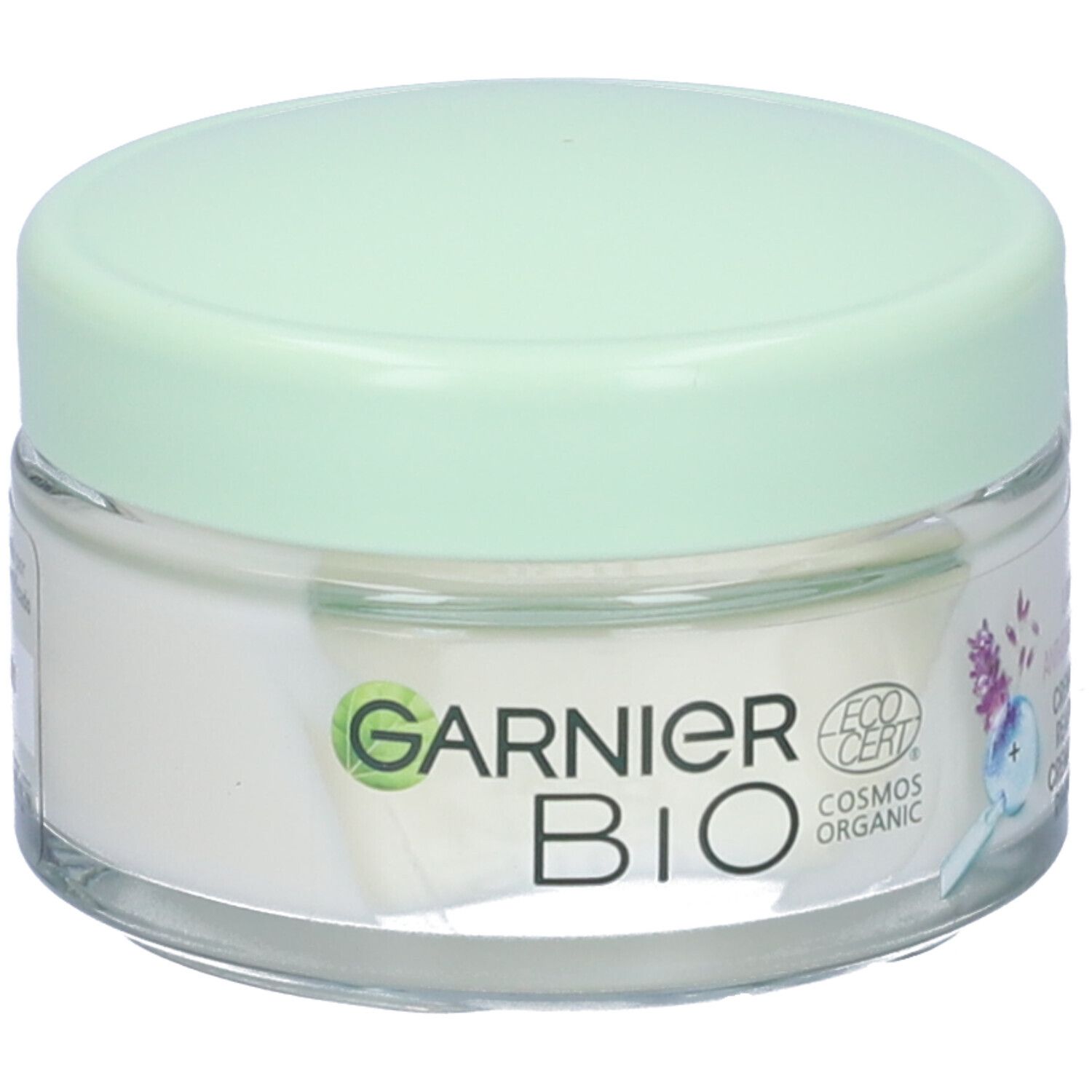 Vasetto di crema con coperchio verde. Scritta Garnier BIO, logo EcoCert. Prodotto cosmetico.