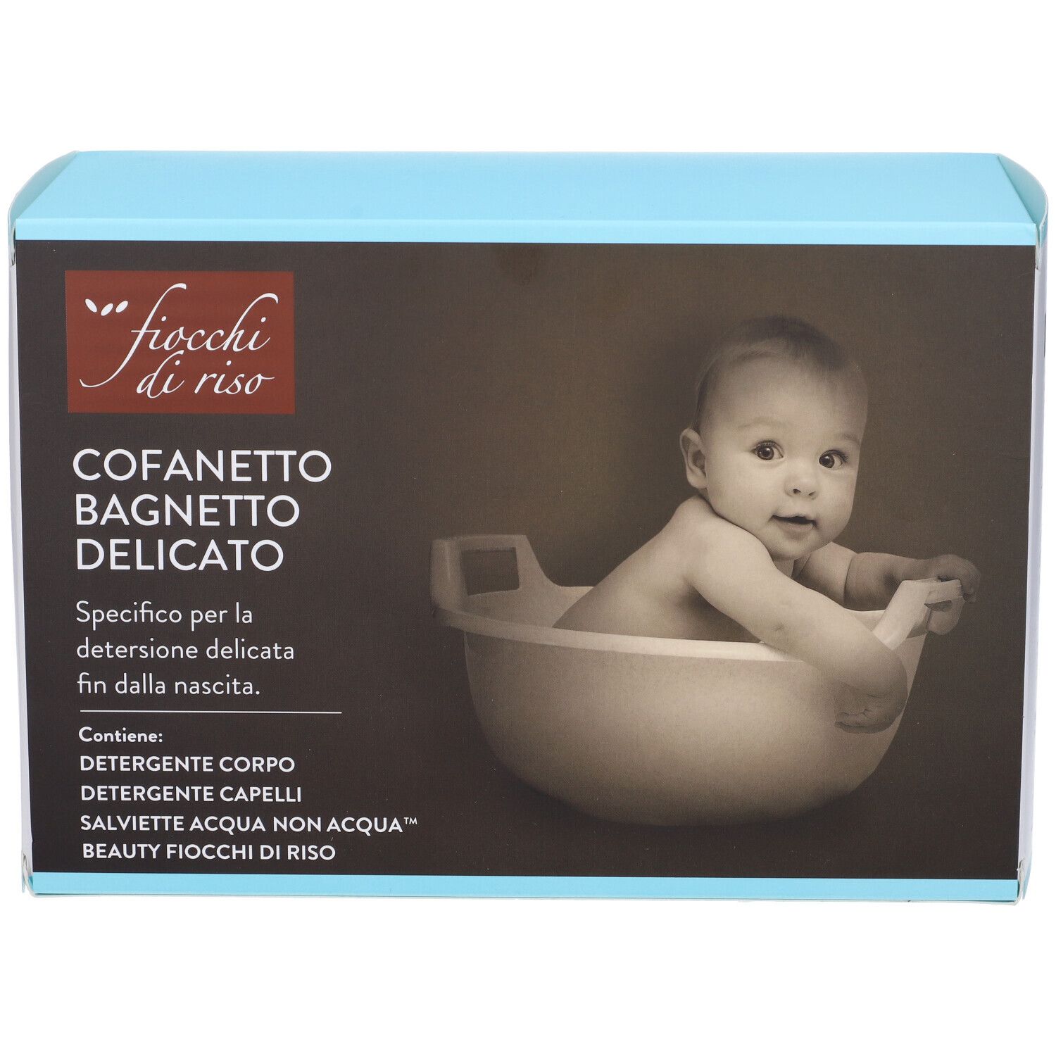 Scatola azzurra con nome prodotto e foto bambino. Contiene detergente corpo e capelli, e salviette.