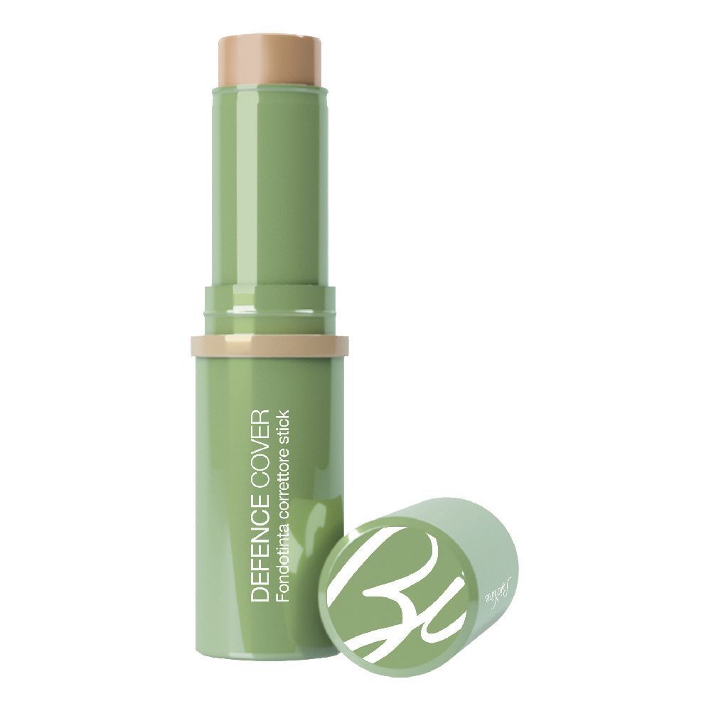 Stick verde con punta beige e tappo. Scritta: DEFENCE COVER. Aperto, stick e tappo accanto.