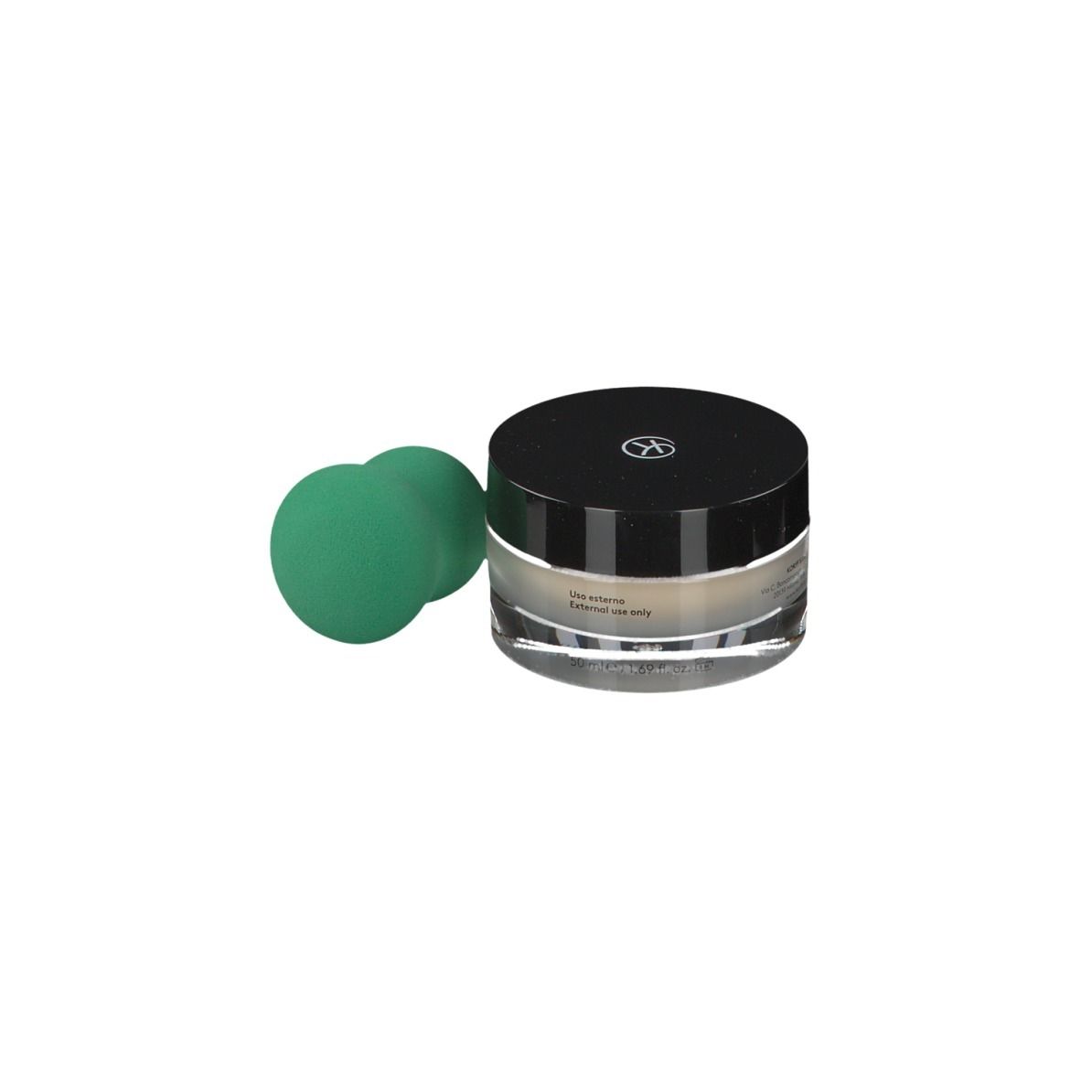 Vasetto di vetro con coperchio nero e spugna verde. Scritta: KORFF Perfect Balance.