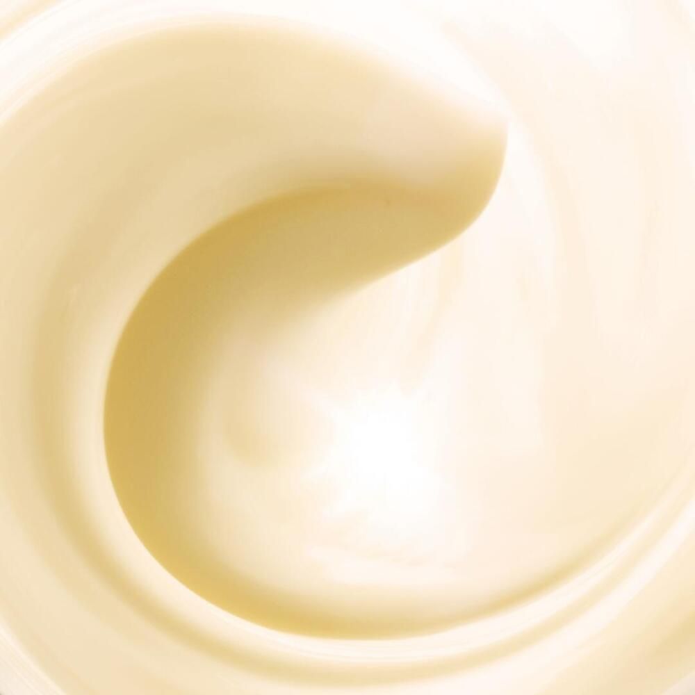 Primo piano di una sostanza color crema, ondulata. La consistenza è liscia e lucida.