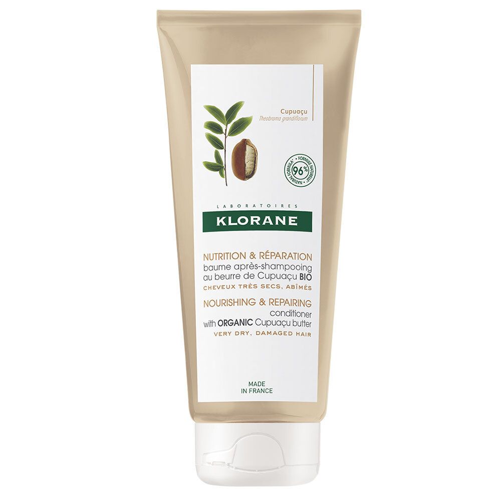 Tube beige avec bouchon blanc. Inscriptions: KLORANE, nom du produit, illustration de fruit et feuilles de Cupuaçu. 96% ingrédients naturels.