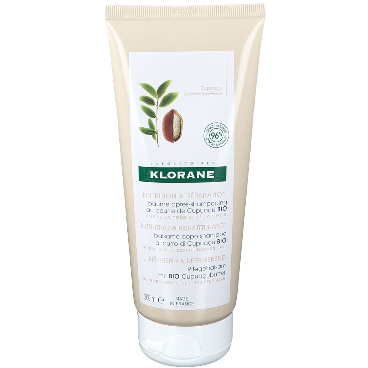 Tube beige avec bouchon blanc. Inscriptions: KLORANE, nom du produit, illustration de fruit et feuilles de Cupuaçu. 200ml.