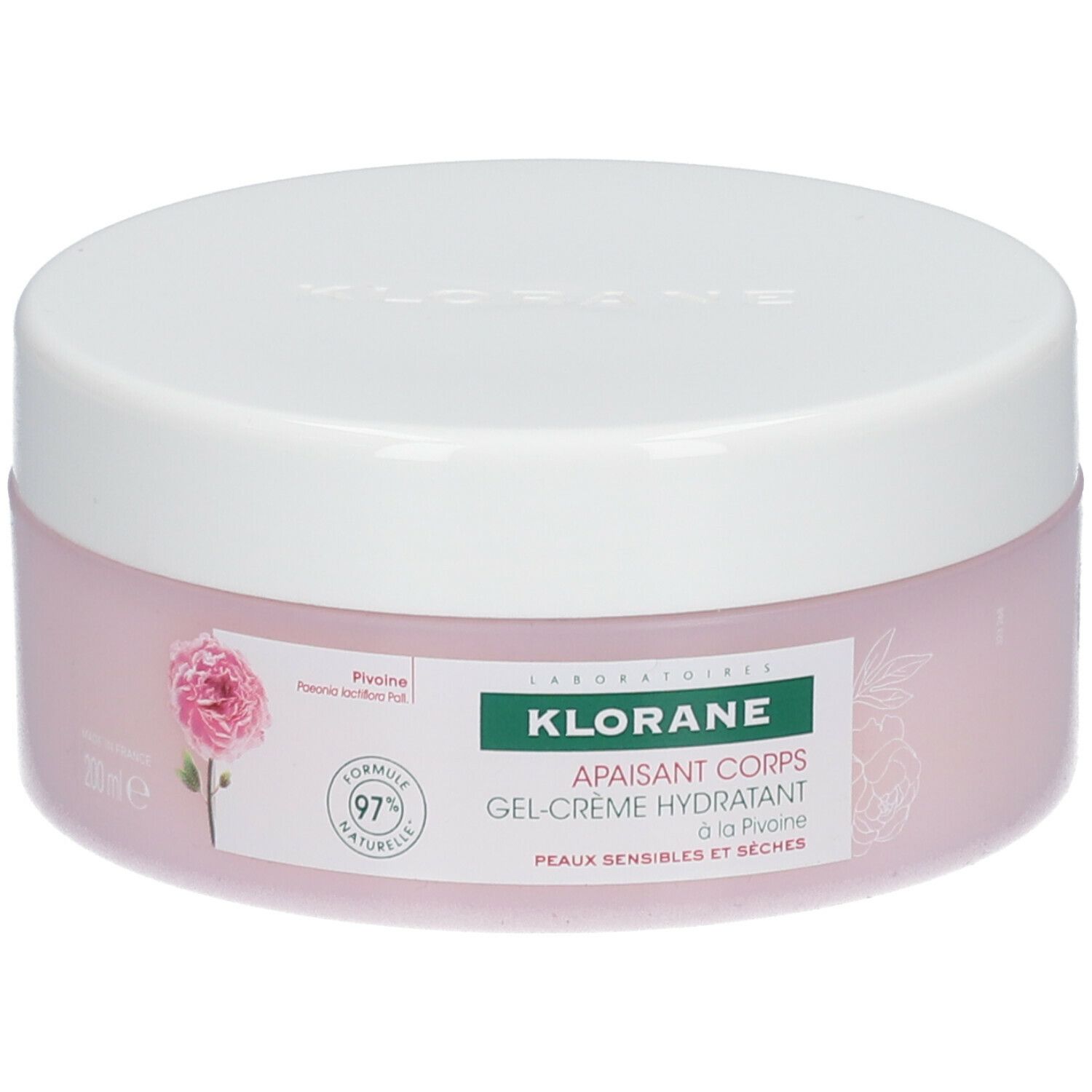 Vaso rotondo rosa con coperchio bianco. Scritta: KLORANE, gel-crema corpo lenitiva alla peonia. Formula naturale al 97%.