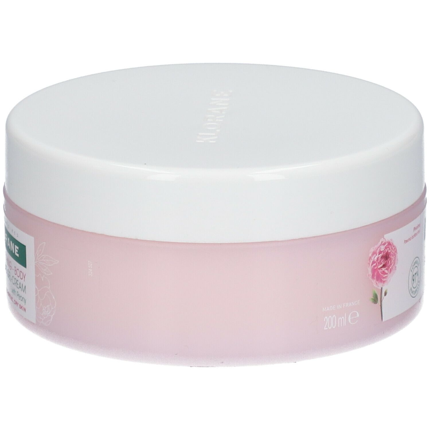 Vaso rotondo rosa con coperchio bianco. Scritta: KLORANE, gel-crema corpo lenitiva alla peonia. 200ml.