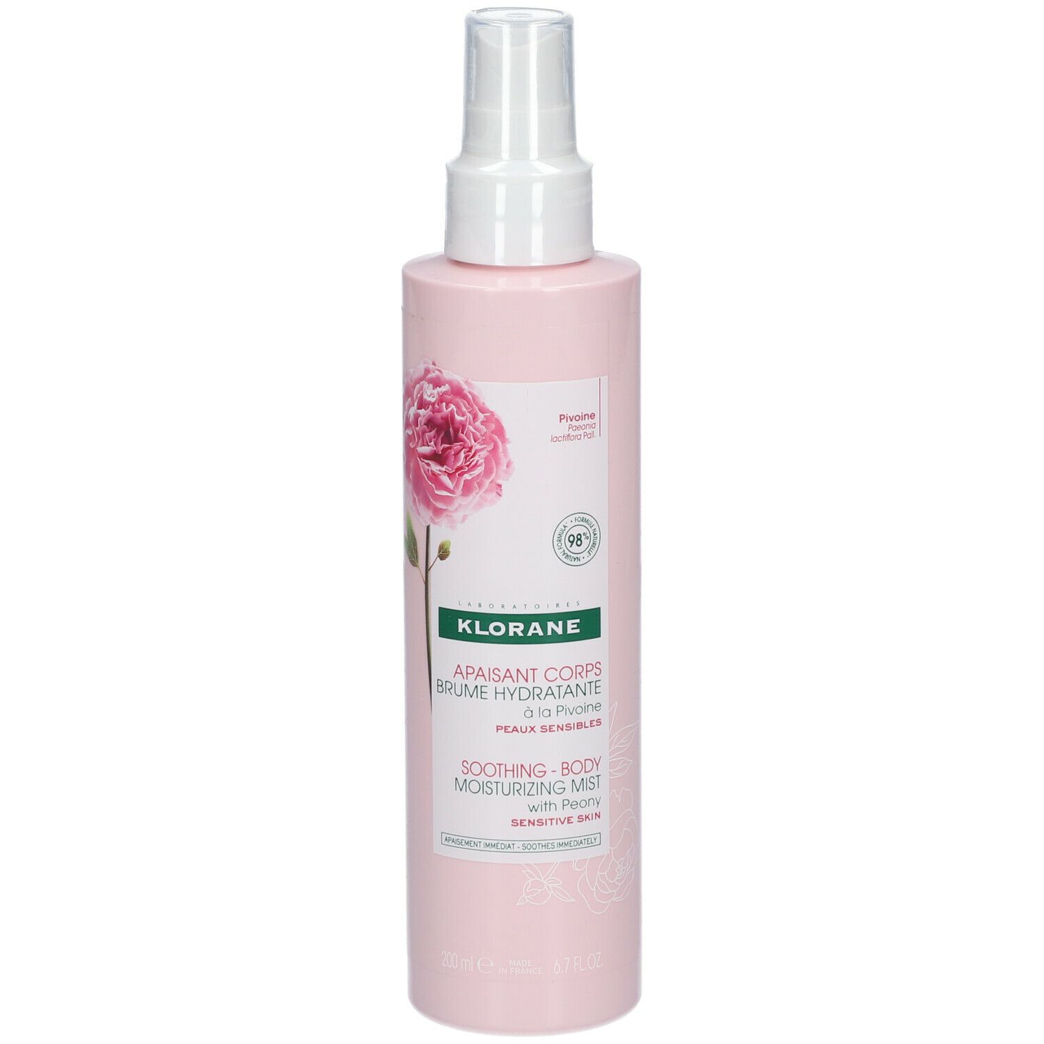 Flacone rosa con vaporizzatore. Etichetta con informazioni sul prodotto e illustrazione di peonia. Marca: KLORANE.