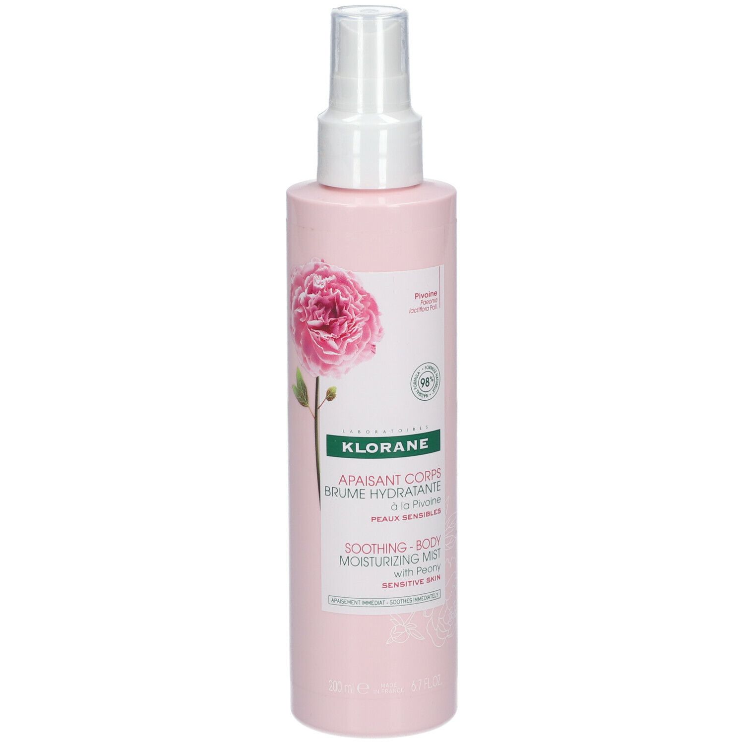 Flacone rosa con vaporizzatore. Etichetta con informazioni sul prodotto e illustrazione di peonia. Marca: KLORANE.