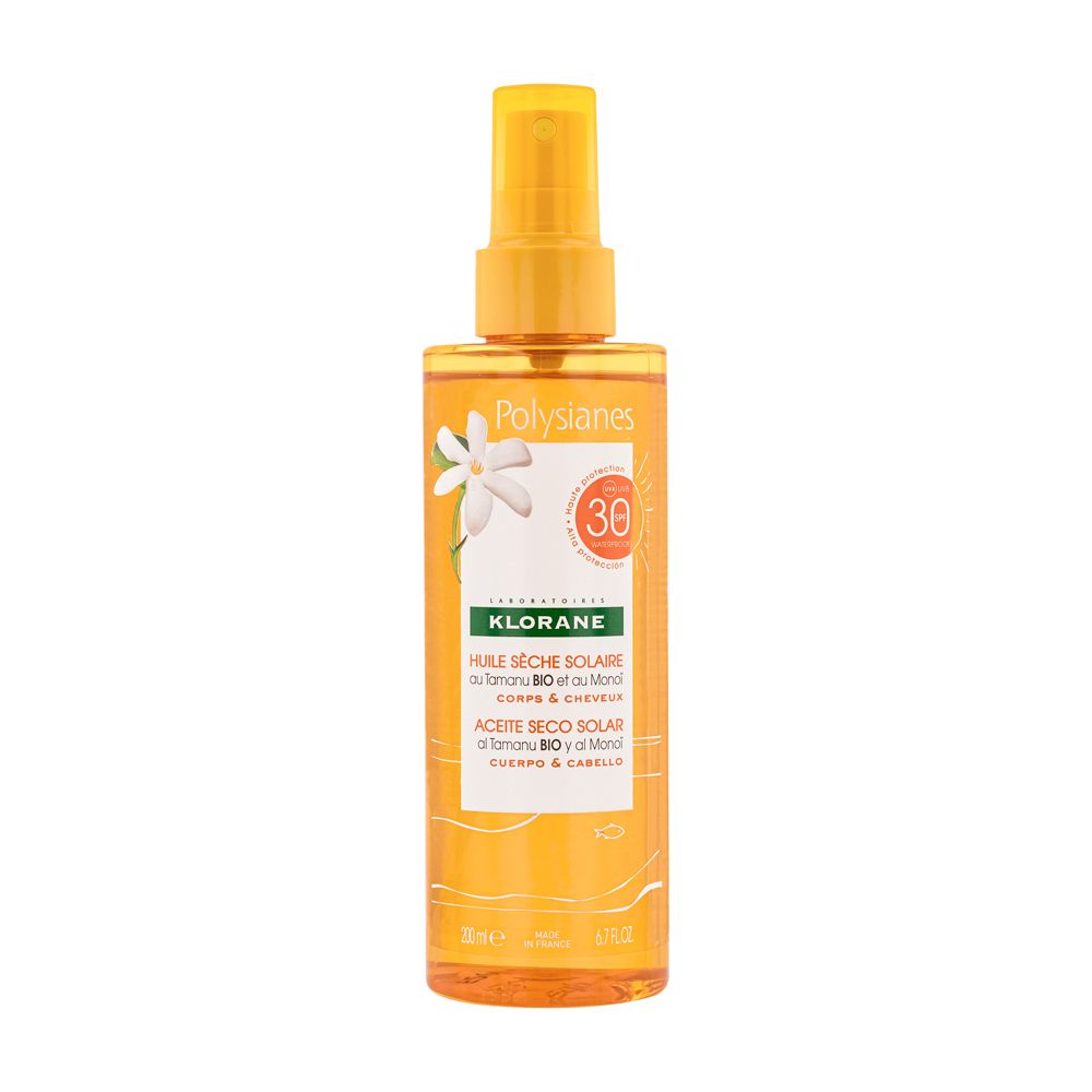 Huile sèche solaire Klorane Polysianes SPF30. Flacon spray jaune, fleur blanche, indication SPF30.