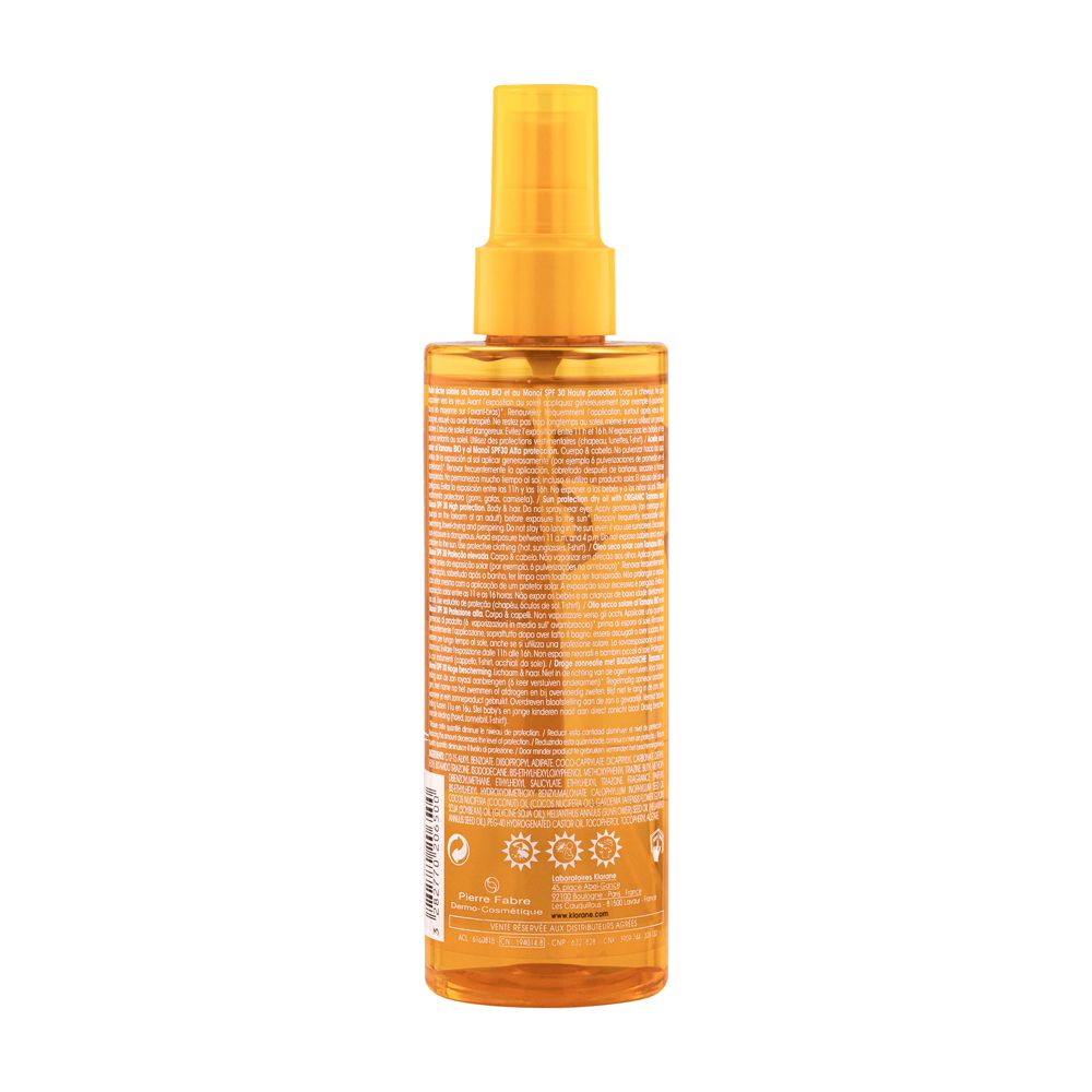 Dos du flacon Klorane Polysianes huile sèche solaire SPF30. Informations textuelles.
