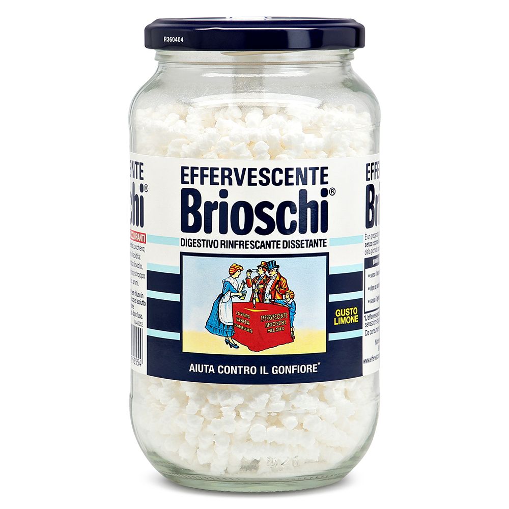 Barattolo di vetro con compresse bianche. Scritta: Effervescente Brioschi®. Coperchio blu. Etichetta con illustrazione.