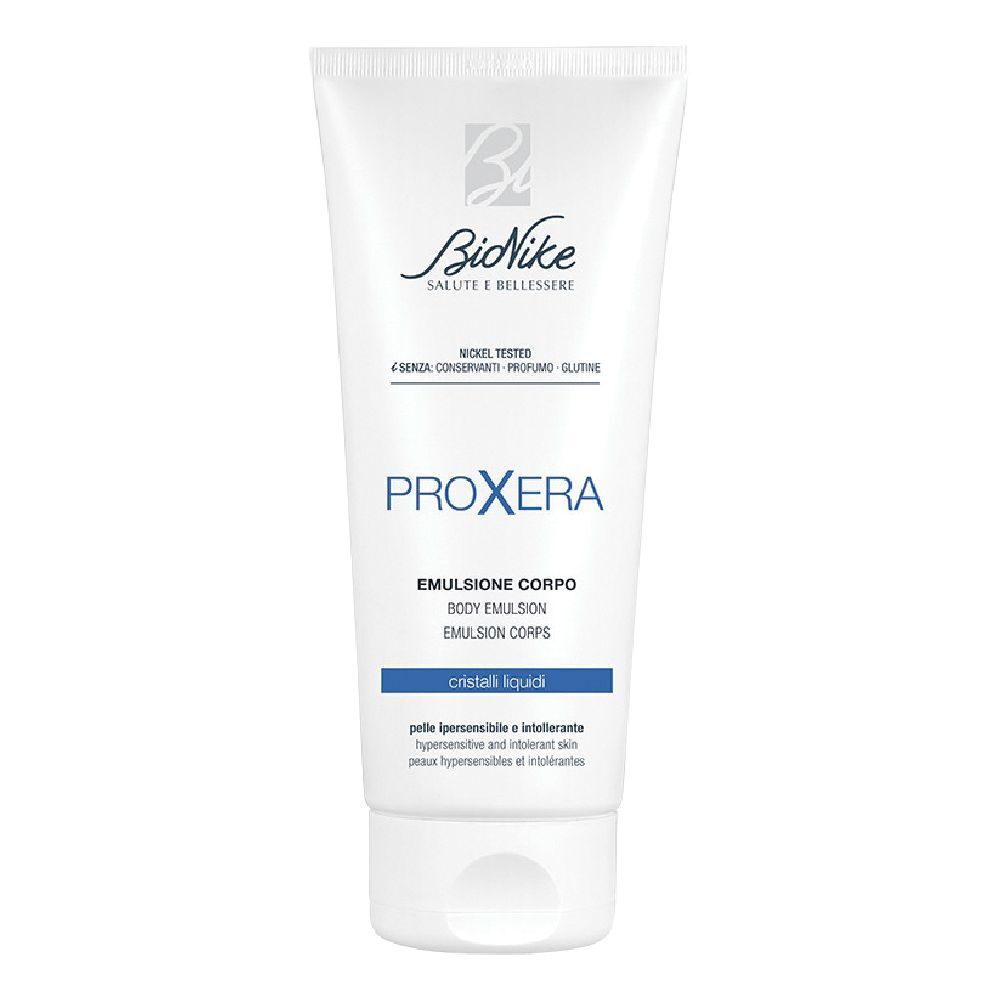 Tubo bianco con testo blu. Scritta: Bionike, Proxera, Emulsione Corpo, Cristalli Liquidi.