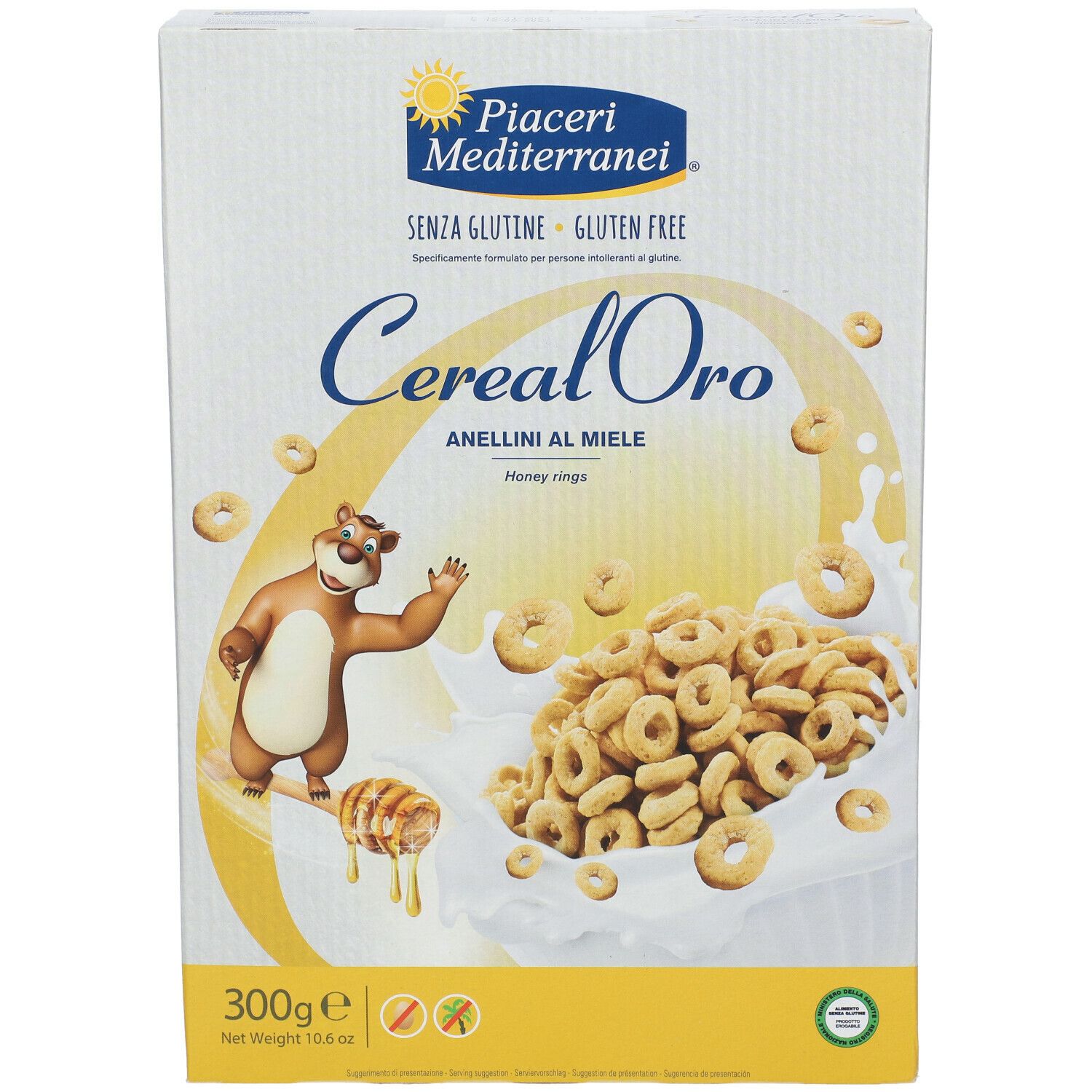 Vista frontale della confezione Piaceri Mediterranei Cereal Oro Anellini al Miele. Scritte: senza glutine, 300g, anellini al miele, illustrazione orso.