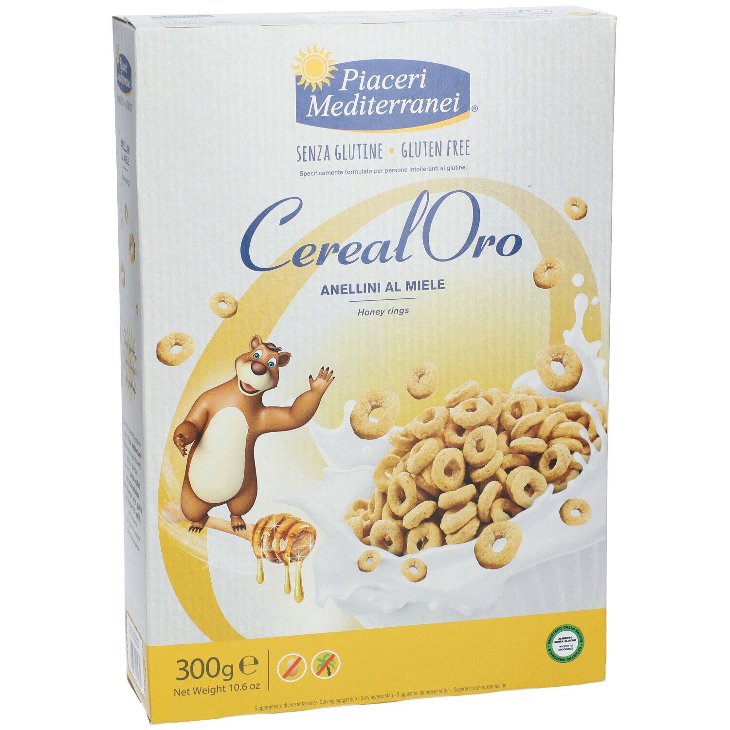 Vista frontale della confezione Piaceri Mediterranei Cereal Oro Anellini al Miele. Scritte: senza glutine, 300g, anellini al miele, illustrazione orso.