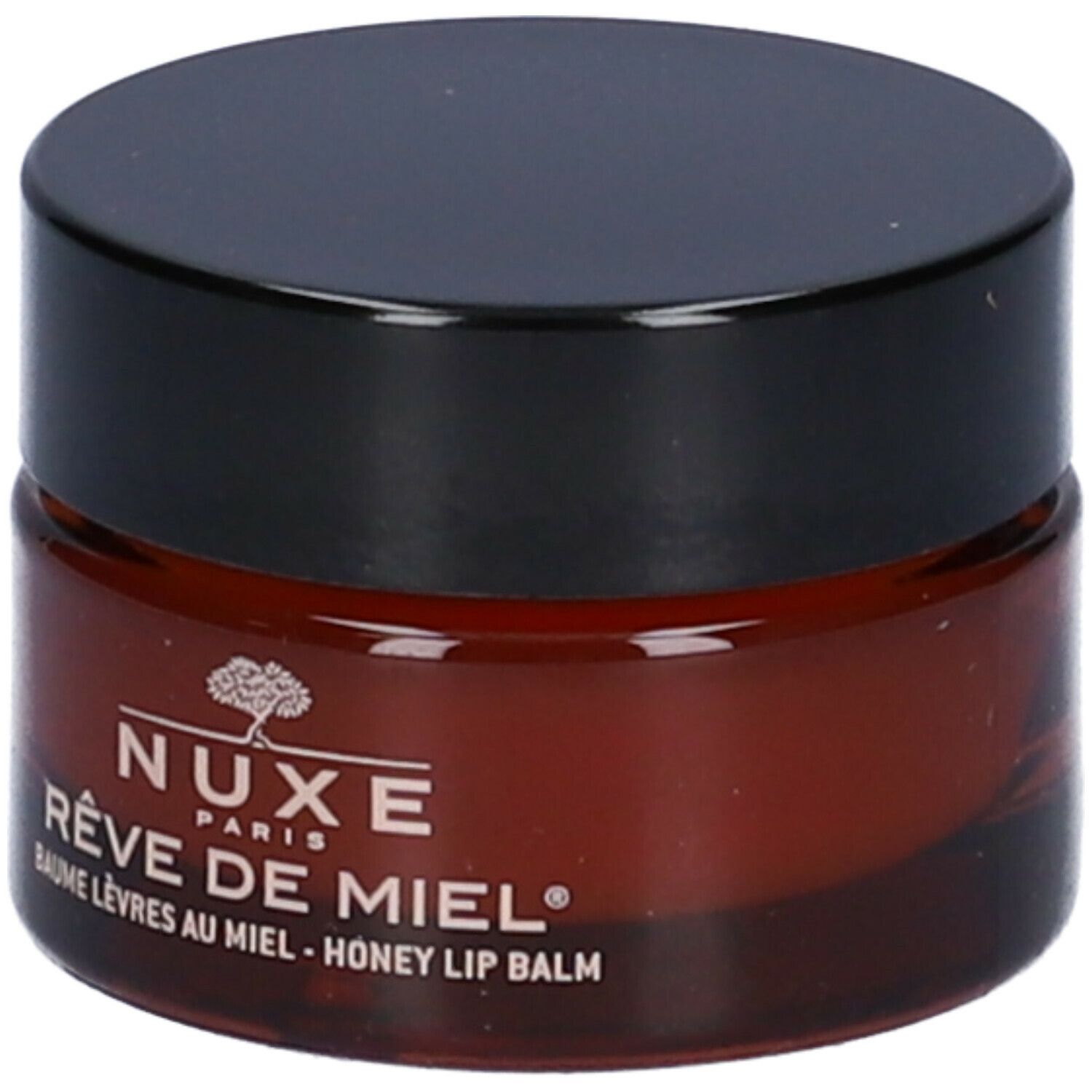 Vasetto rotondo di balsamo marrone con coperchio nero. Scritta: NUXE Rêve de Miel.